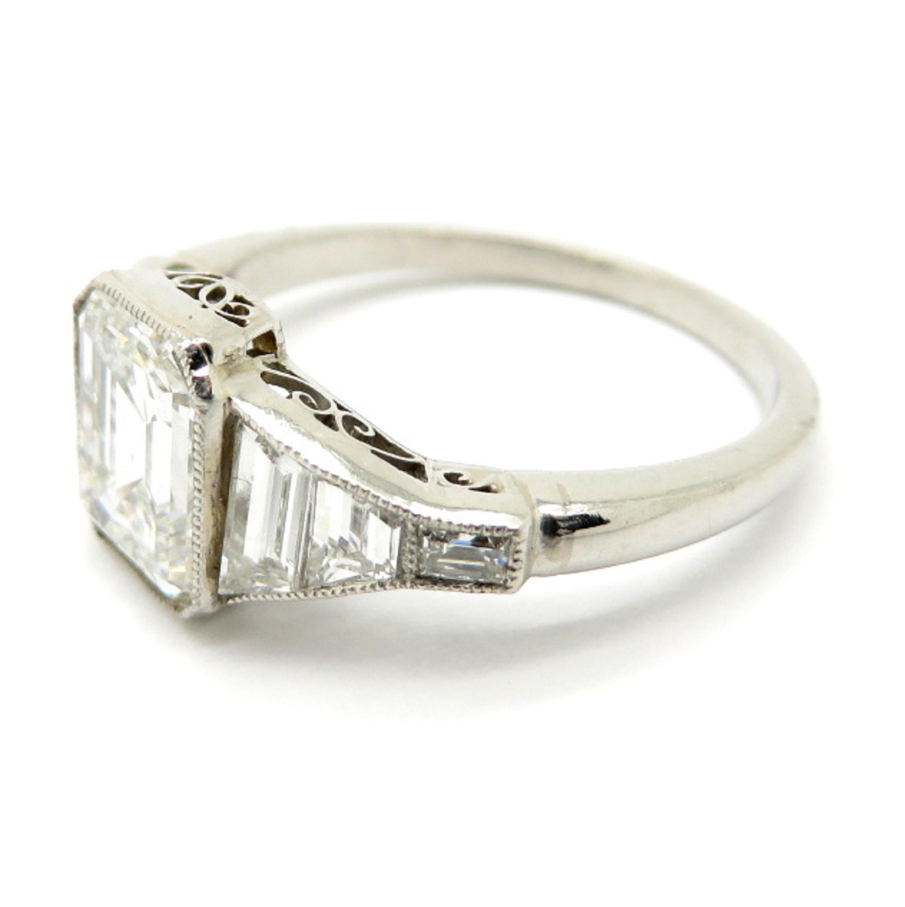 For sale is a stunning Platinum Diamond GIA Certified Engagement Ring with a milgrain border! 
One (1) Emerald Cut diamond, bezel set in a milgrain design, weighs approximately 1.98 carats. 
Diamond Grading: Color Grade: E. Clarity Grade: VS1.