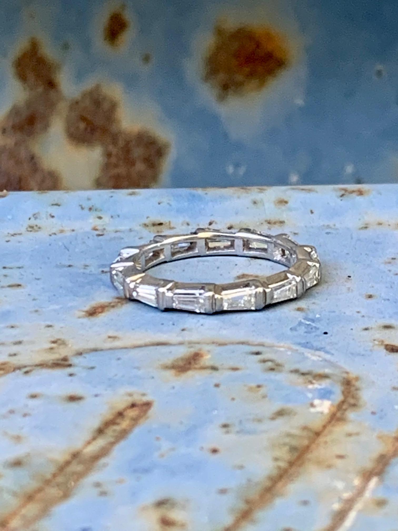 This beautiful eternity band features 1 ctw of Diamond tapered baguettes which completely encircle the entire band.

Size: 5 1/2
Weight 3.8 grams