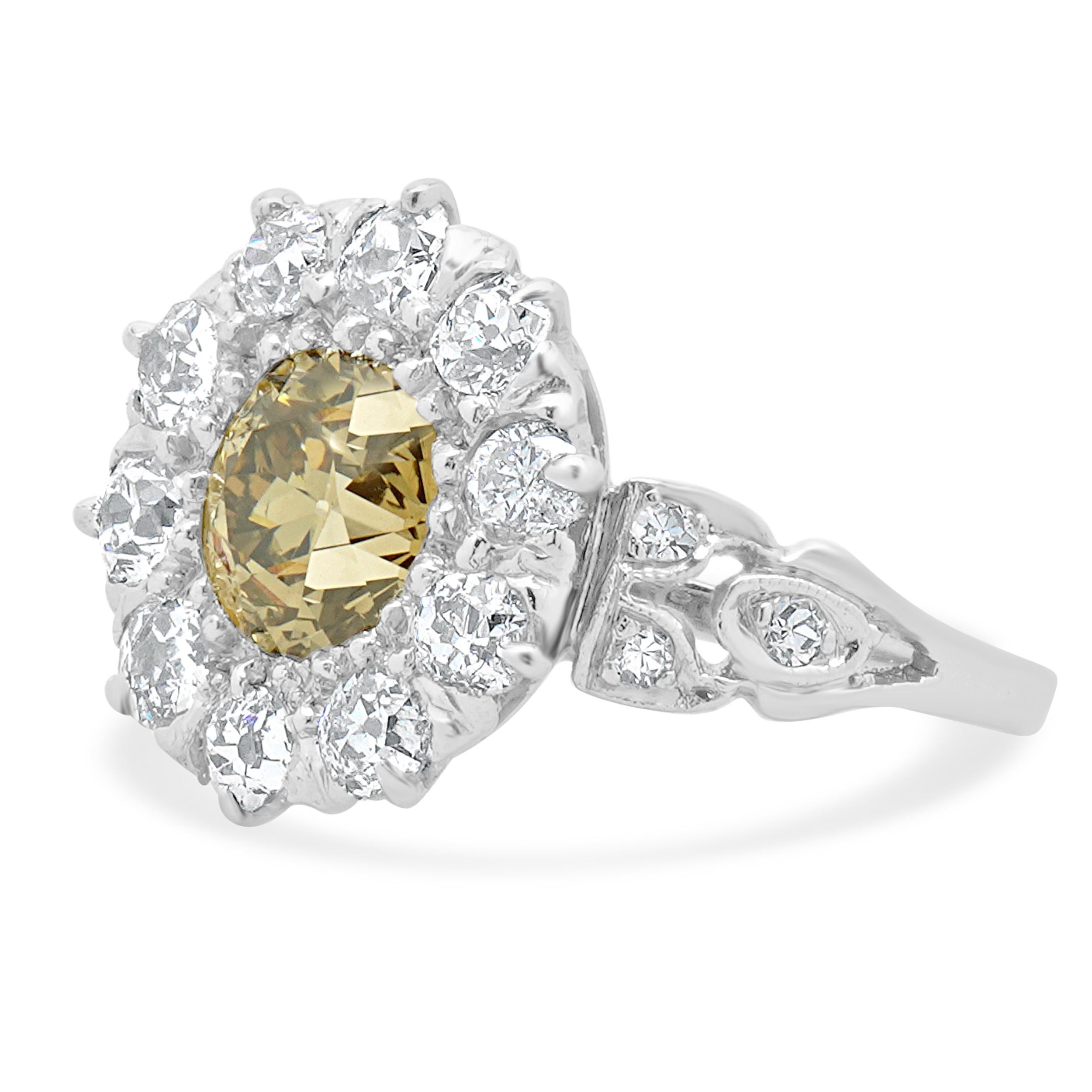 Material: platinum 
Center Diamond: 1 european cut = 1.10ct
Color: Champagne
Clarity: VS2
Diamond: old mine cut = 1.06cttw
Color: I
Clarity: SI1
Ring Size: 5 (please allow up to 2 additional business days for sizing requests)
Dimensions: ring top