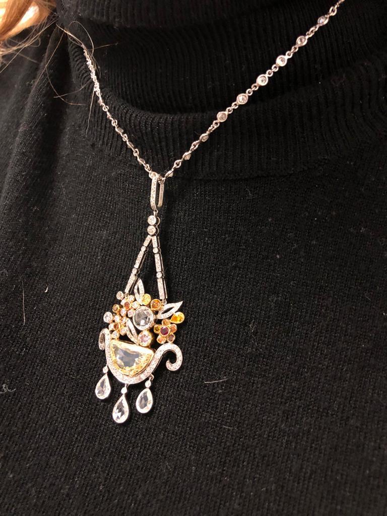 Designed as a suspending flower basket motif, this superb necklace is exquisitely crafted with fancy yellow and white diamonds of different shapes and sizes, finely mounted in Platinum.
Circa 1990’s
Approx. 19.5