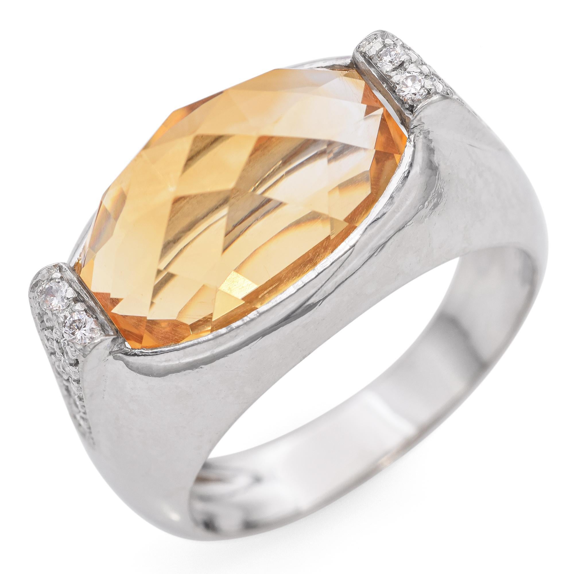 A sleek and elegant ring featuring a fancy cut oval-shaped citrine of a warm yellow hue. This unique cut enhances the stone’s natural beauty by providing additional facets, creating a more intricate play of light and depth. The ring is accented by