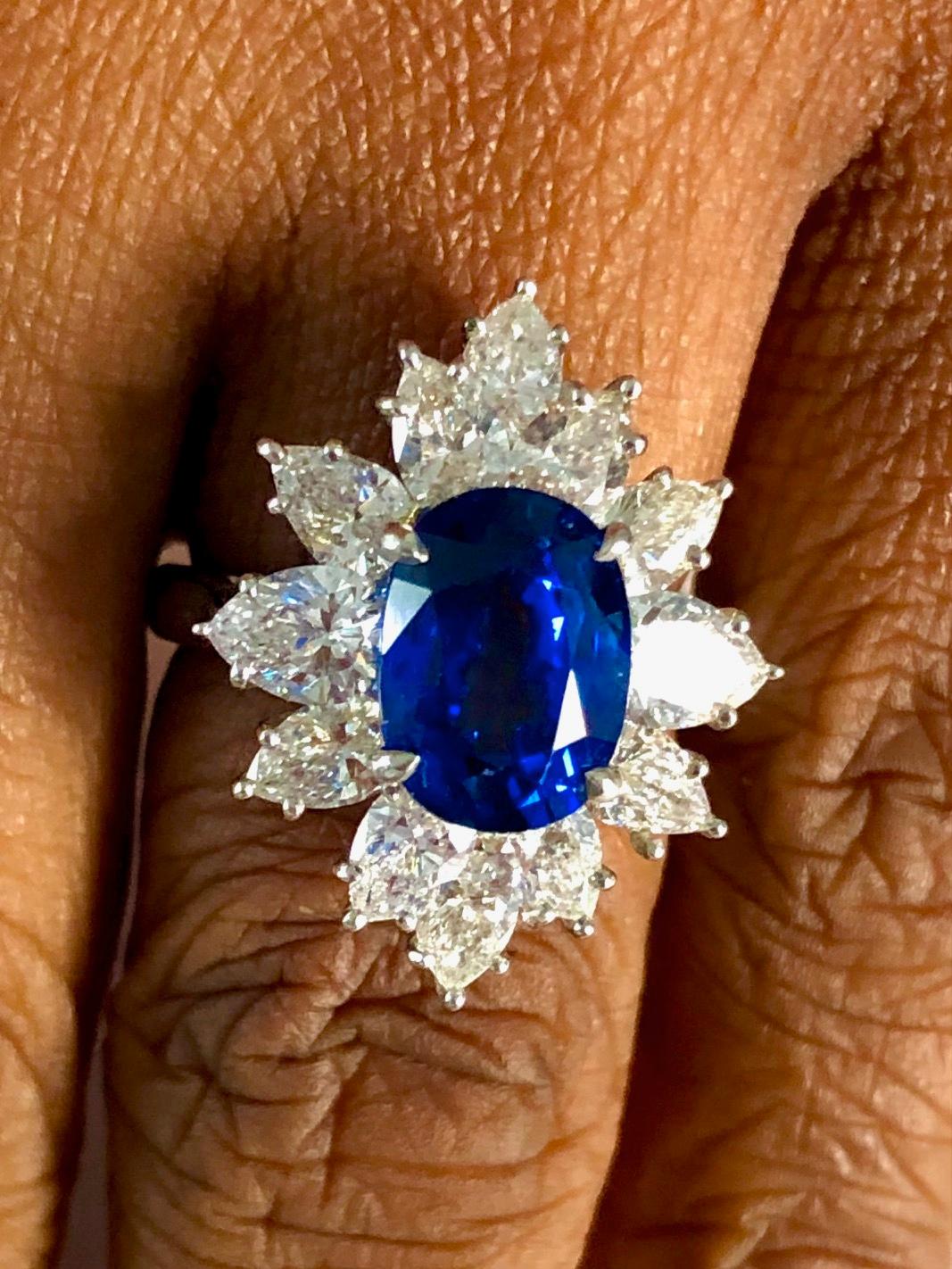 Classic design, handmade Platinum Ring set with 12 Pear Shape high quality Diamonds 2.99 carats, and a Royal Blue Ceylon Sapphire 4.30 carats.

We design and manufacture our jewelry in our workshop, located in New York City's diamond district.