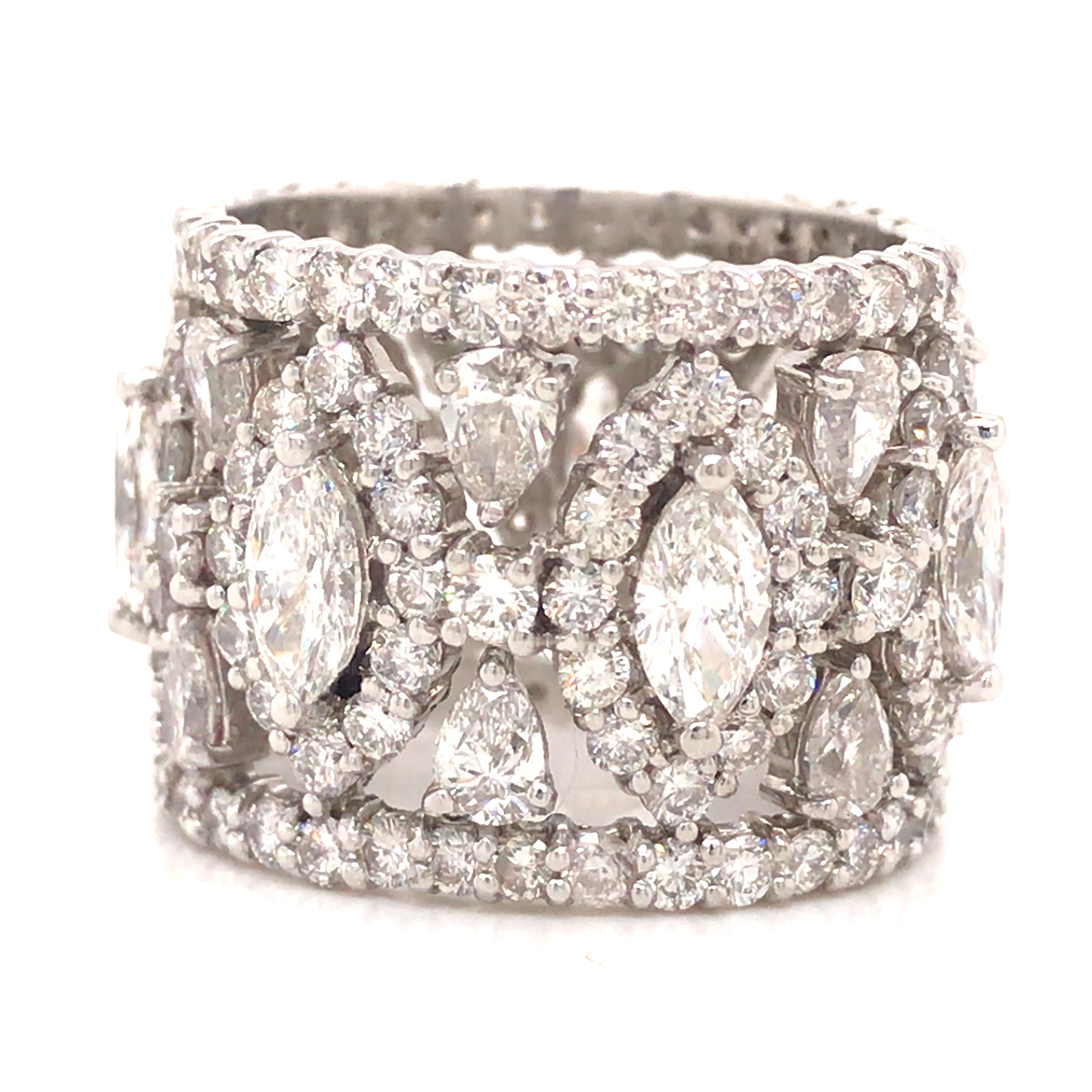 Fancy Shape Diamond Wide Eternity Band in Platinum.  (7) Marquise Shape, (14) Pear Shape and Round Brilliant Cut Diamonds weighing 8.82 carat total weight, G-H in color and VS-SI in clarity are expertly set.  The Ring measures 3/8 inch in width. 
