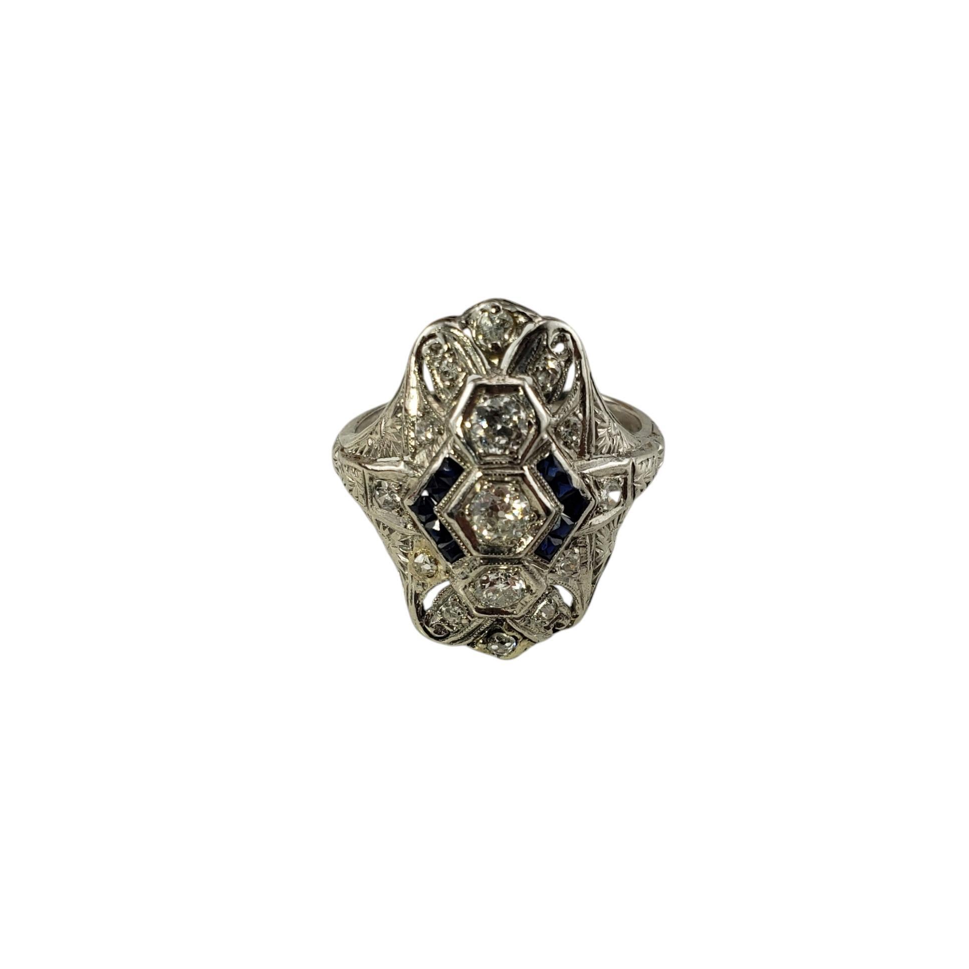 Platinum Filigree Diamond and Sapphire Ring Size 7.5

This sparkling ring features 3 old mine cut diamonds (center), 12 round single and brilliant cut diamonds and 10 round sapphires set in beautifully detailed platinum filigree.
Top of ring