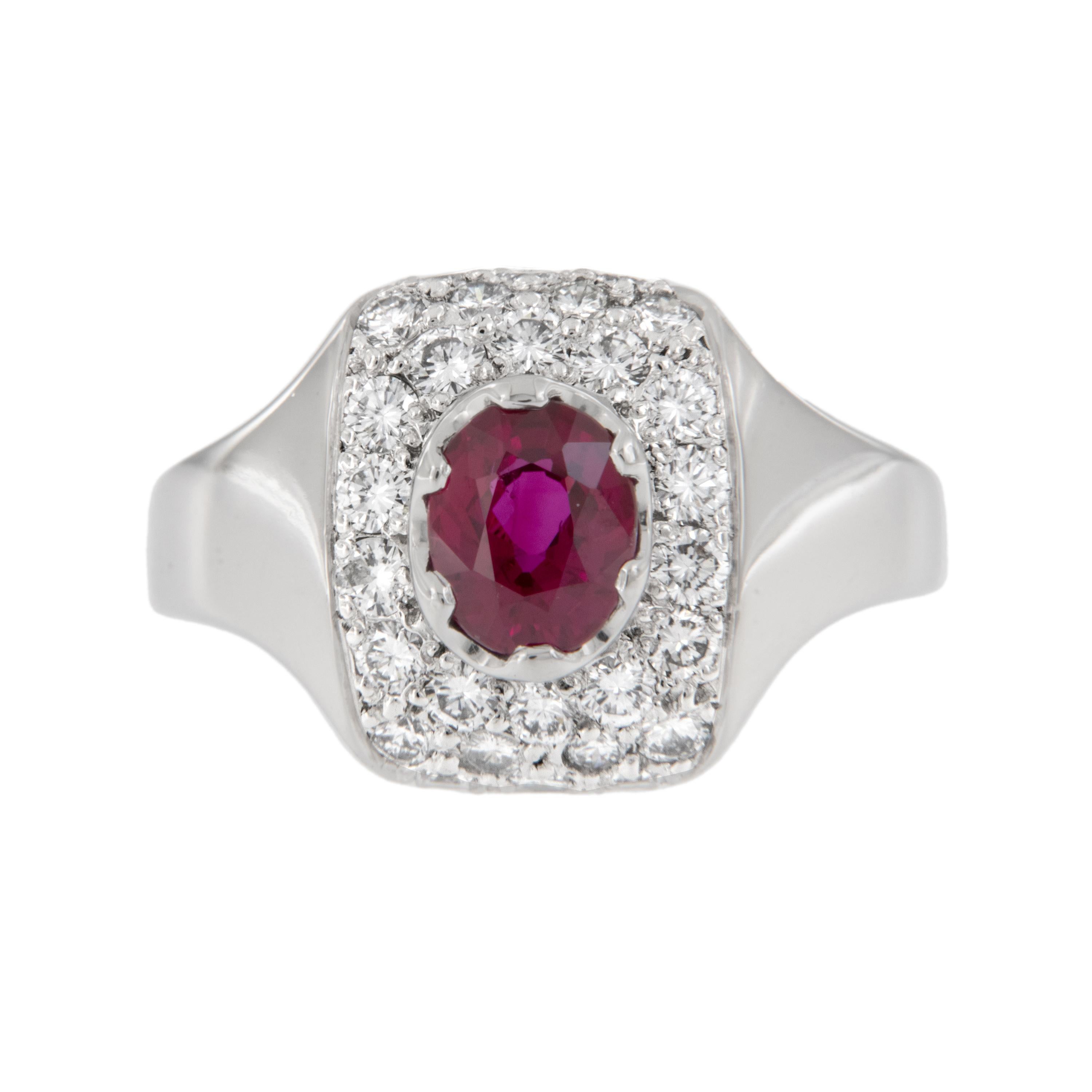 Crafted in noble platinum, this ring showcases a 1.05 carat ruby of exceptional color and clarity, surrounded by three quarters of a carat  ( 0.75 Cttw) of fine quality diamonds pave' set in a pretty cushion shape to set off the ruby perfectly. Ring