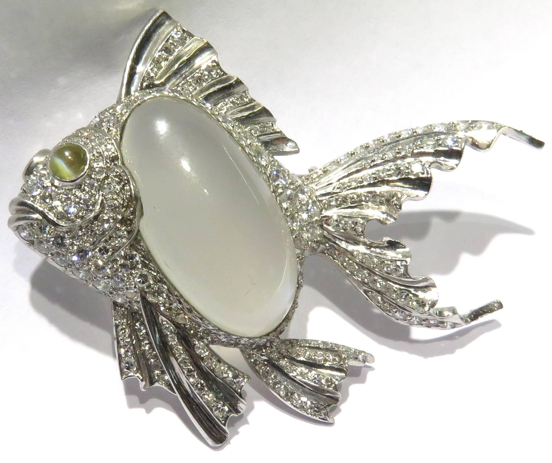 This large incredible platinum pin is made with so much quality! The large oval shape moonstone has a beautiful blueish hue and the chrysoberyl cats eye has a very sharp eye. The moonstone weighs approx 40ct. and there are approx 2.35ct