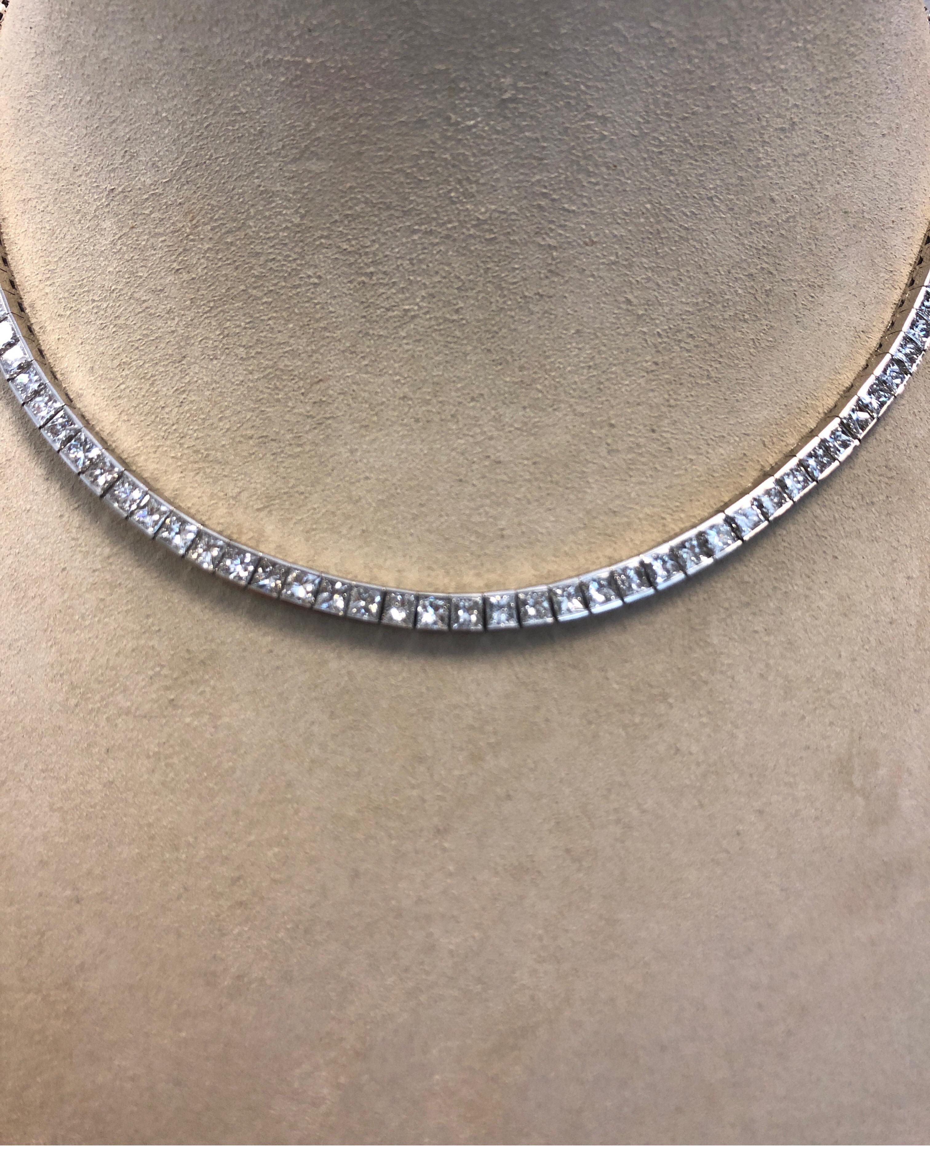 Platinum flexible necklace, channel set with 98 square Princess cut diamonds, G color, VS clarity, 16.5 inches long, safety clasp.
Last retail $28,500