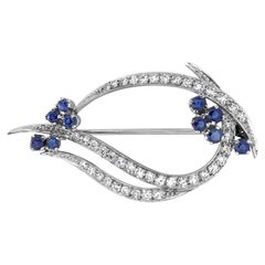 Platinum Flower Cluster Spray Brooch with Diamond Leaves and Sapphires 