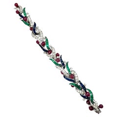 Bracciale in platino con diamanti e gemme multiple dal design fogliaceo