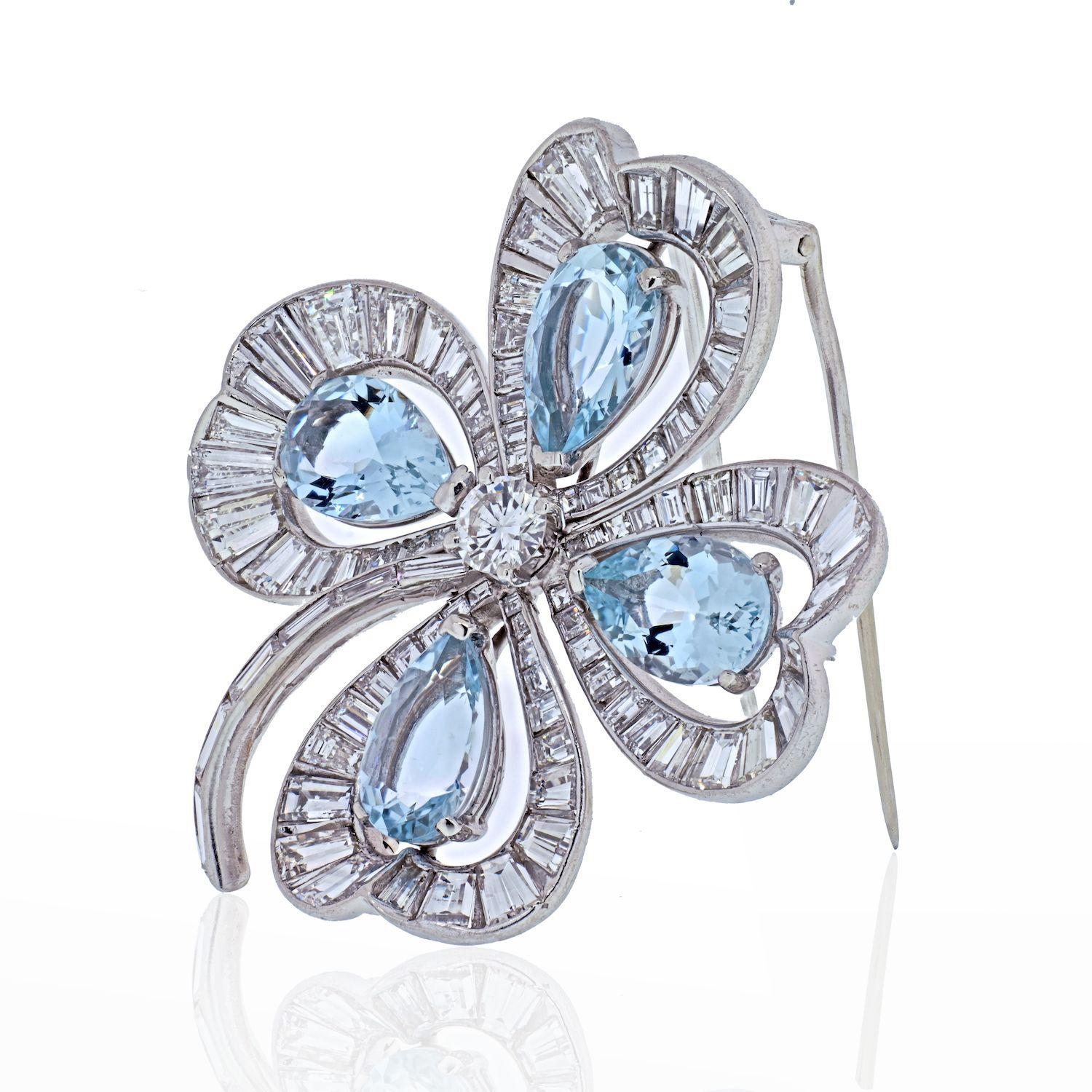 Platinum Four Leaf Clover With Aquamarines And Diamonds Brooch.
Center diamond: Round Cut 5.3mm wide (approx. 0.67ct)
Diamond Carat Weight:11.67cttw
Aquamarine Carat Weight: 10.12cttw
Measurmeents: 49mm wide and 46mm long. 
Closure: Double pin