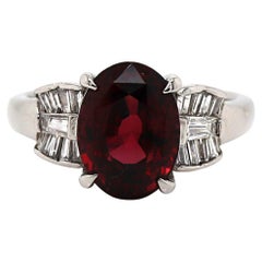 Bague habillée en platine avec grenat et diamant