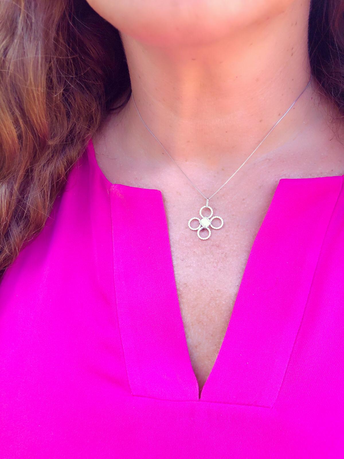 Modern, charming and elegant in one, this clover pendant features a GIA 0.97-ct. Asscher-cut diamond center, graded H/VS1, with the handmade four-petal clover micro-set with 59 round brilliant-cut diamonds, giving the pendant a total diamond weight