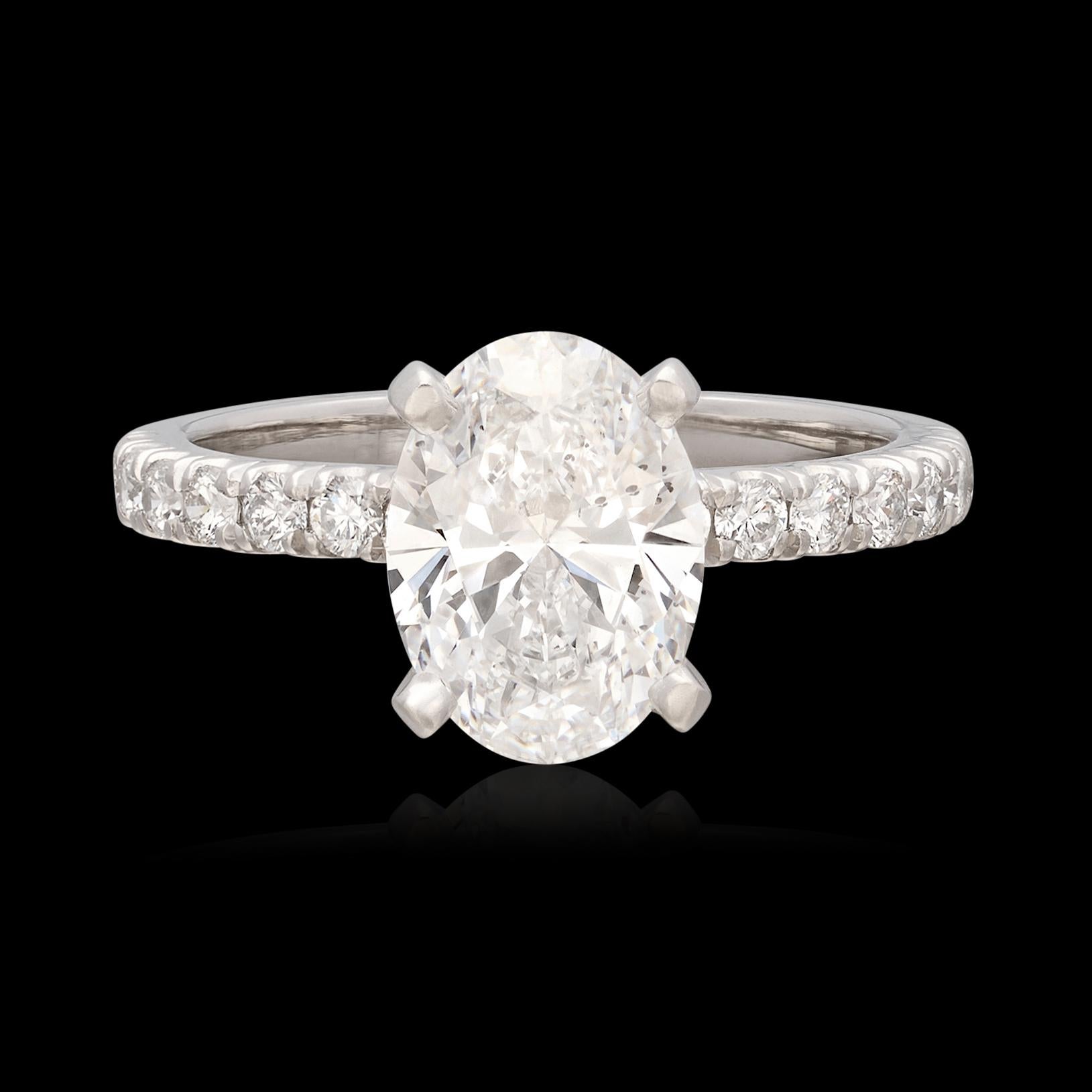 Looking to stand out from the crowd? This gorgeous platinum diamond ring is sure to do the trick. Featuring a GIA graded 1.80 carat Oval Diamond expertly set with 4 prongs in a classic Platinum setting with 14 fine melee diamonds set in the shank