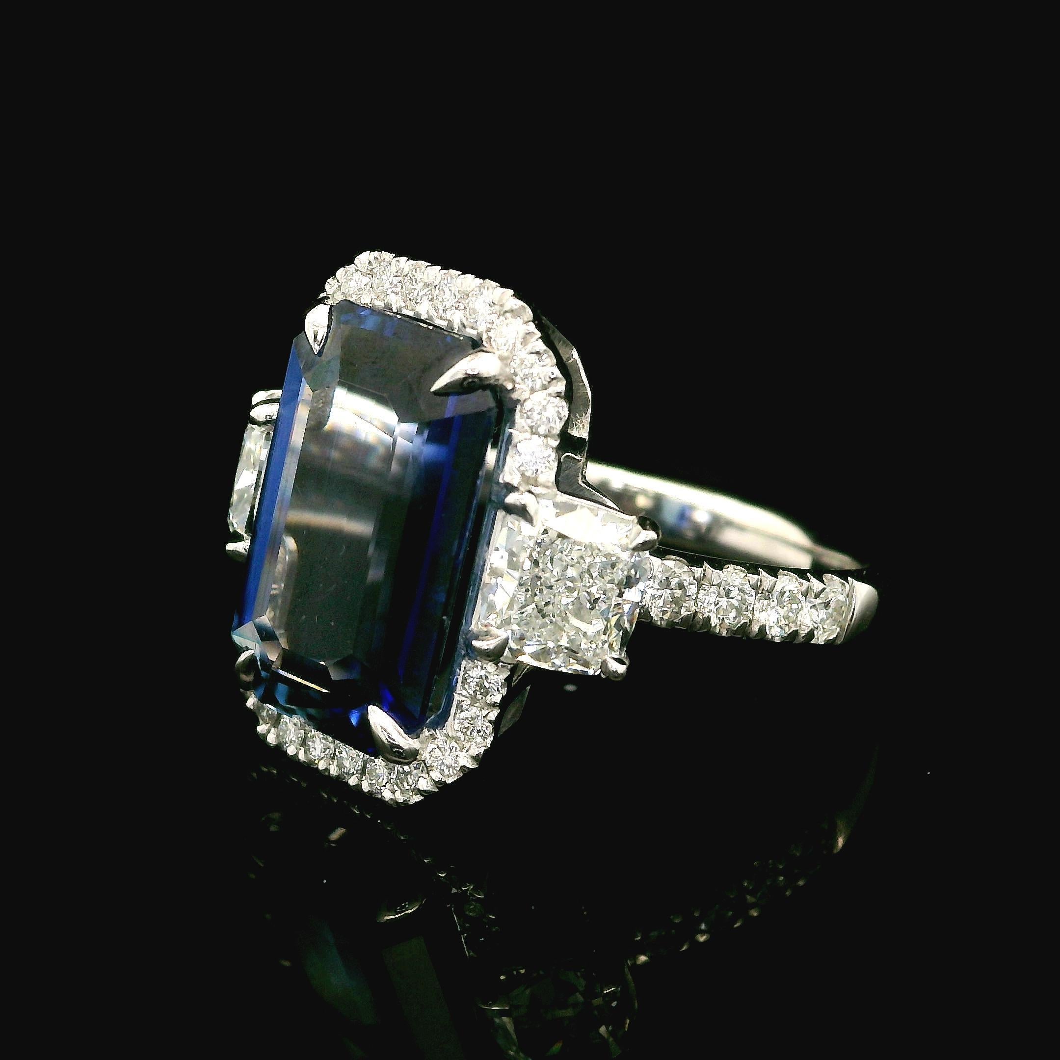 --Stone(s):--
(1) Natural Genuine Sapphire - Elongated Emerald Cut - Prong Set - Clean Vivid Blue Color - Heated -8.06ct (exact - certified)
** See Certification Details Below for Complete Info **
(2) Natural Genuine Diamonds - Cushion Cut - Prong