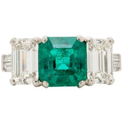 Vintage Platinum GIA 1.20 Carat Colombian Emerald and 1.10 Carat Emerald Cut Diamonds