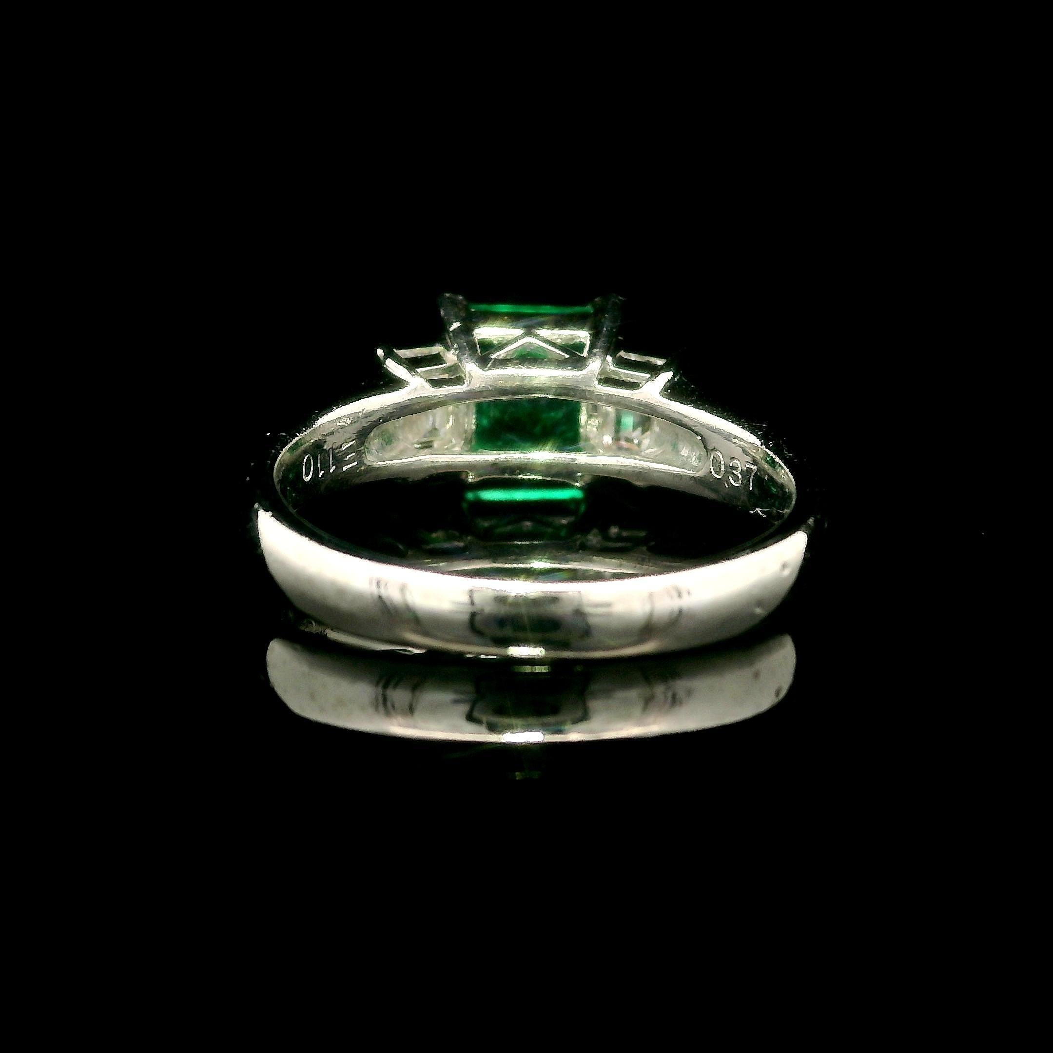 --Stone(s):--
(1) Natural Genuine Emerald - Colombian - Minor Oil - Squared Octagonal Step Cut - Prong Set - Very Nice Brilliant Green Color - 1.10ct (exact)
** See Certification Details Below for Complete Info **
(2) Natural Genuine Diamonds -