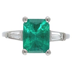 Retro Platinum GIA 1.87 Carat Emerald and Diamond Ring