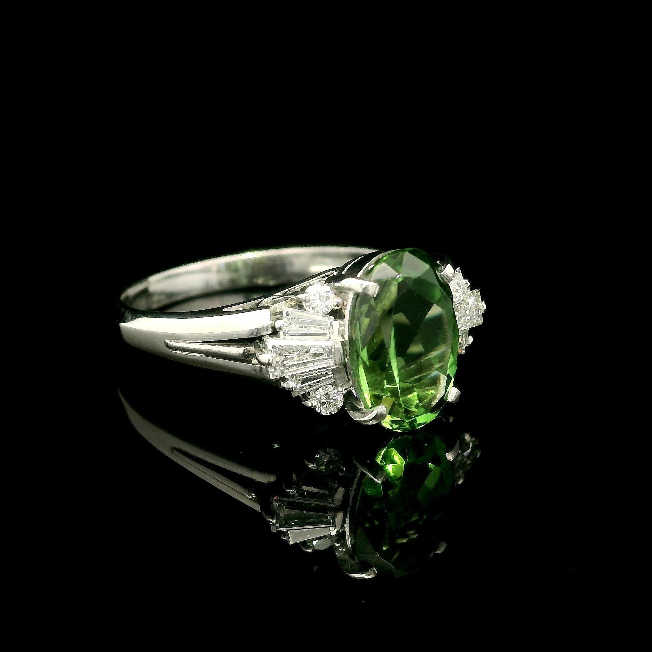 --Stone(s):--
(1) Natural Genuine Chrome Tourmaline - Oval Brilliant Cut - Prong Set - Yellowish Green Color - 2.09ct (exact)
** See Certification Details Below for Complete Info **
(10) Natural Genuine Diamonds - Baguette & Round Brilliant Cut -