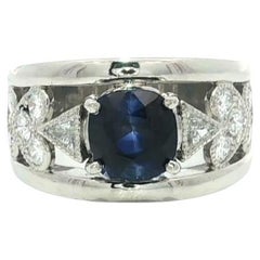 Platinum GIA 2.74ctw Cushion Sapphire w/ Diamond Heart Sides Wide Band Ring