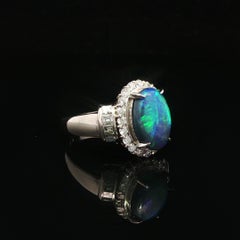 Platinum GIA 2.93ctw Oval Cabochon Black Opal W/ Diamond Halo & Sides Ring