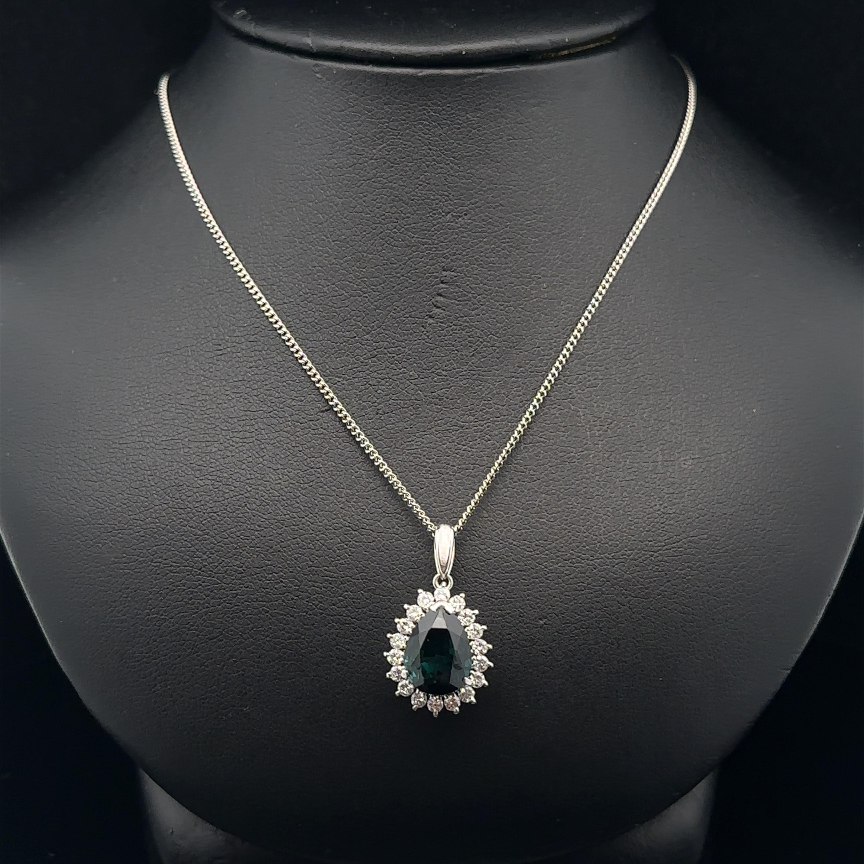 --Stone(s):--
(1) Natural Genuine Tourmaline - Teardrop Pear Brilliant Cut - Prong Set - Bluish Green Color - 3.28ct (exact )
** See Certification Details Below for Complete Info **
(18) Natural Genuine Diamonds - Round Brilliant Cut - Prong Set -