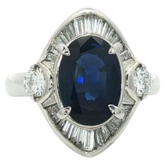 Anello in platino GIA con zaffiro ovale lungo blu reale e accenti di diamante da 4,05 ct.