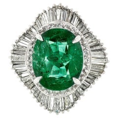 Platinum GIA 5.59 Carat Oval Emerald and Baguette Diamond Wave Ballerina Ring