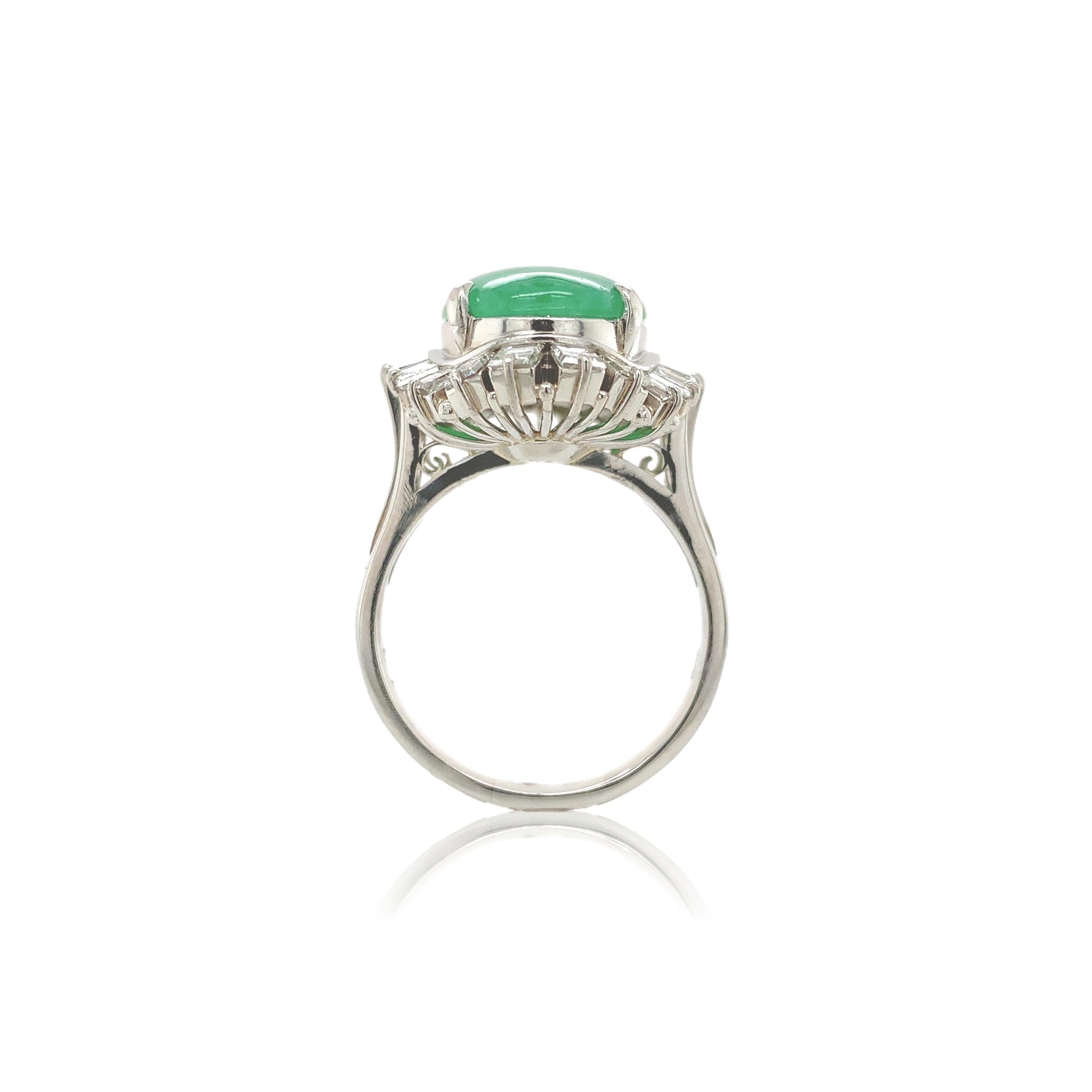 900 Platinum ring featuring a large oval green jadeite jade cabochon. The jade has a GIA report #2225447566 stating natural jadeite grade A, not dyed. The jade measures 15.02mmx x11.09mm x 3.51mm and is translucent with green color - no modifiers.