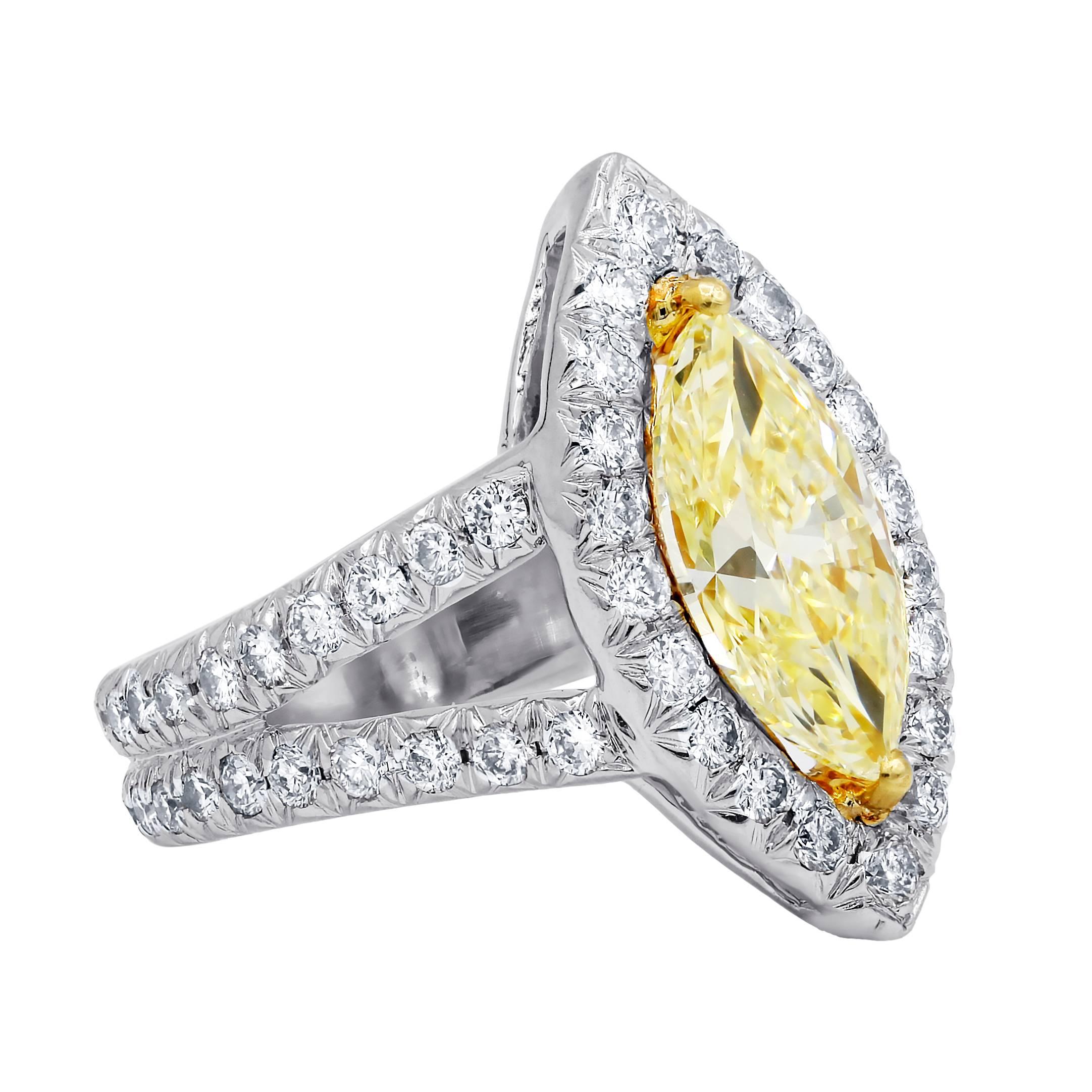 Platinum and 18kt diamond engagement ring with 2.51 cts fancy yellow vs2 
Set in a split shank setting with diamonds set all the way around and in halo
