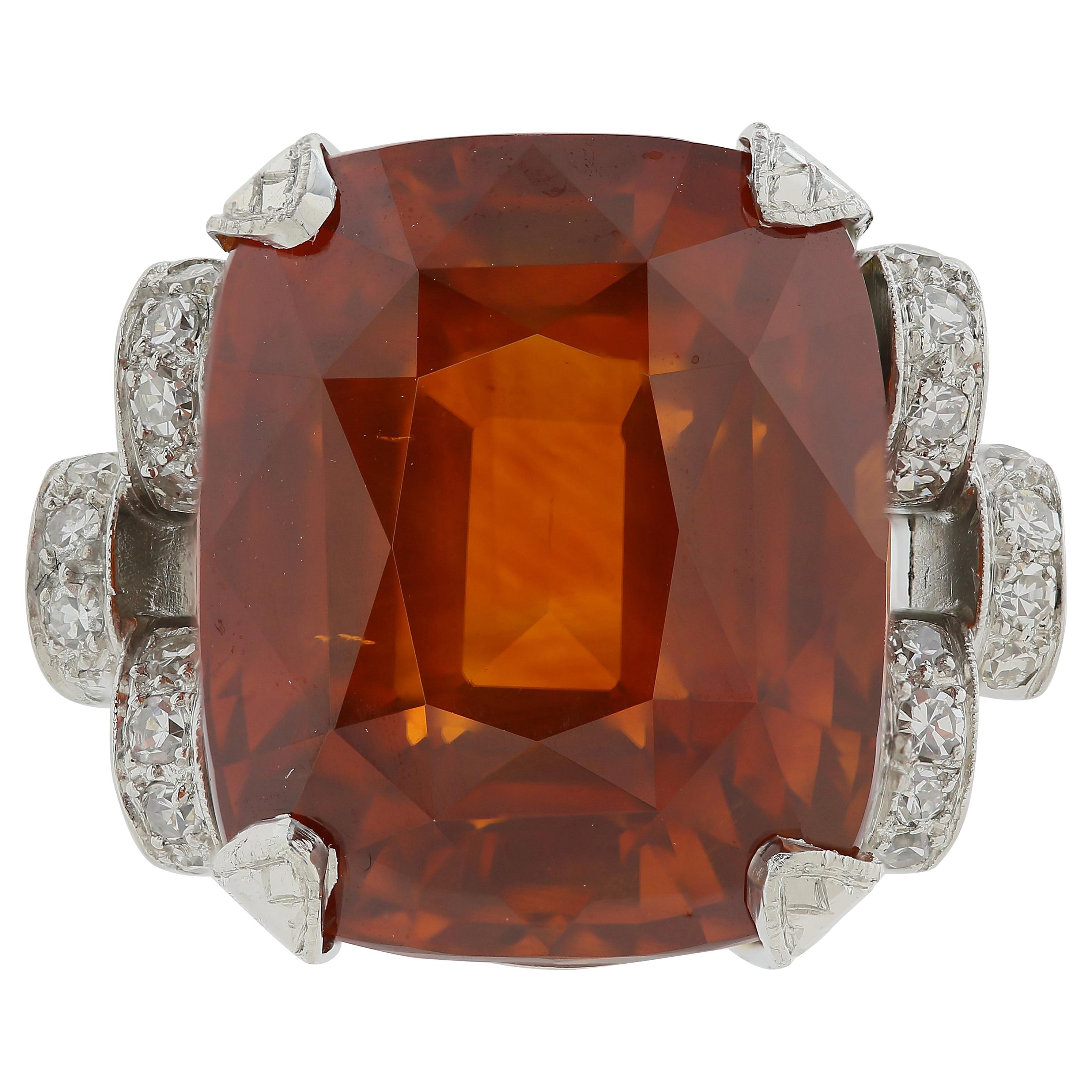 Platinum GIA Certified 25.56 Carat Orange Sapphire and Diamond Ring For Sale