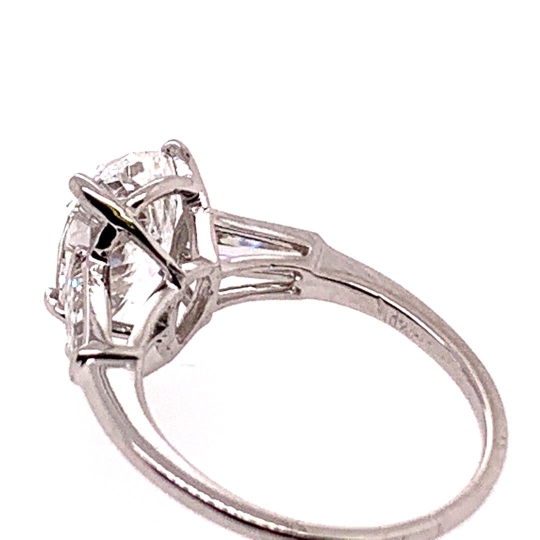 Modern Platinum GIA Certified 3.30 Carat F SI1 XX Pear Shape and Baguette Ring