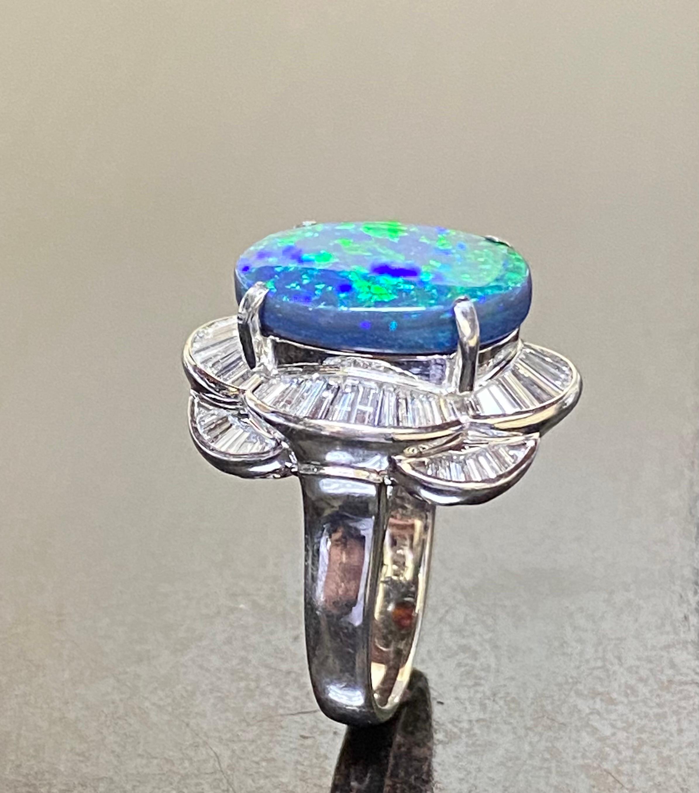 DeKara Designs Collection 

Our latest design! An entirely handmade ONE OF A KIND elegant and lustrous Lightning Ridge Australian Black Opal cabochon surrounded by beautiful baguette diamonds in a platinum setting.

Metal- 90% Platinum, 10% Iridium.