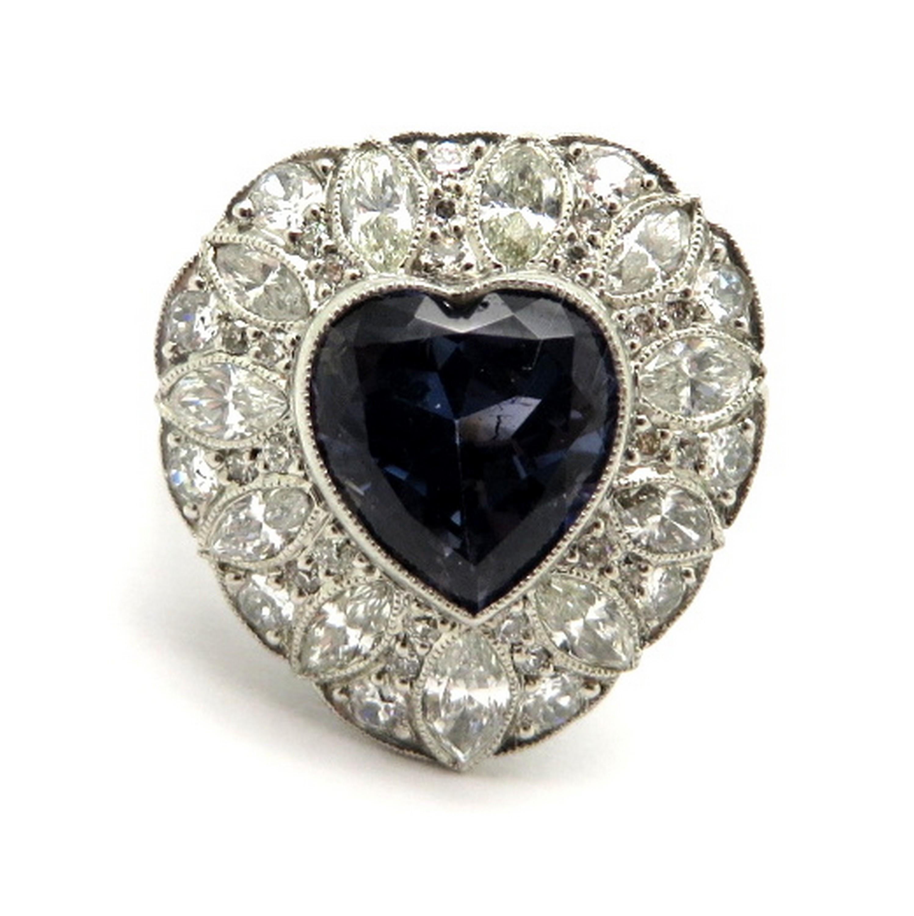 Platinum GIA certified Art Deco style 3.81 bluish Violet Sapphire heart diamond ring. Showcasing one heart shaped GIA certified bluish Violet Sapphire, milgrain bezel set, weighing approximately 3.81 carats. The GIA colored stone grading report is
