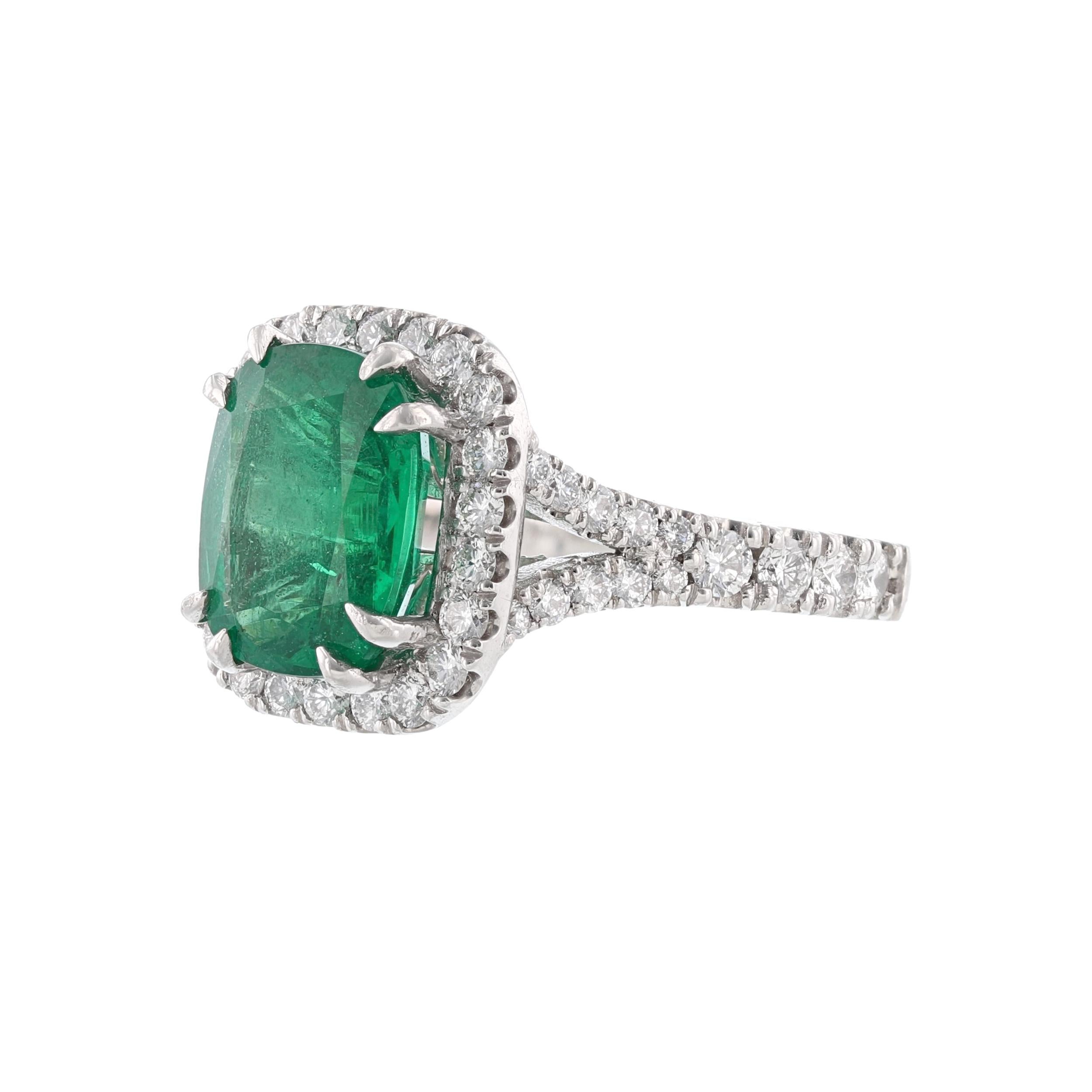 This ring is made in platinum and features 1 cushion cut natural beryl emerald weighing 3.85 carats. With a color grade (Green). The GIA Certification Number 5151329477. Also includes 60 round cut, prong set diamonds weighing  1.35 carats. With a