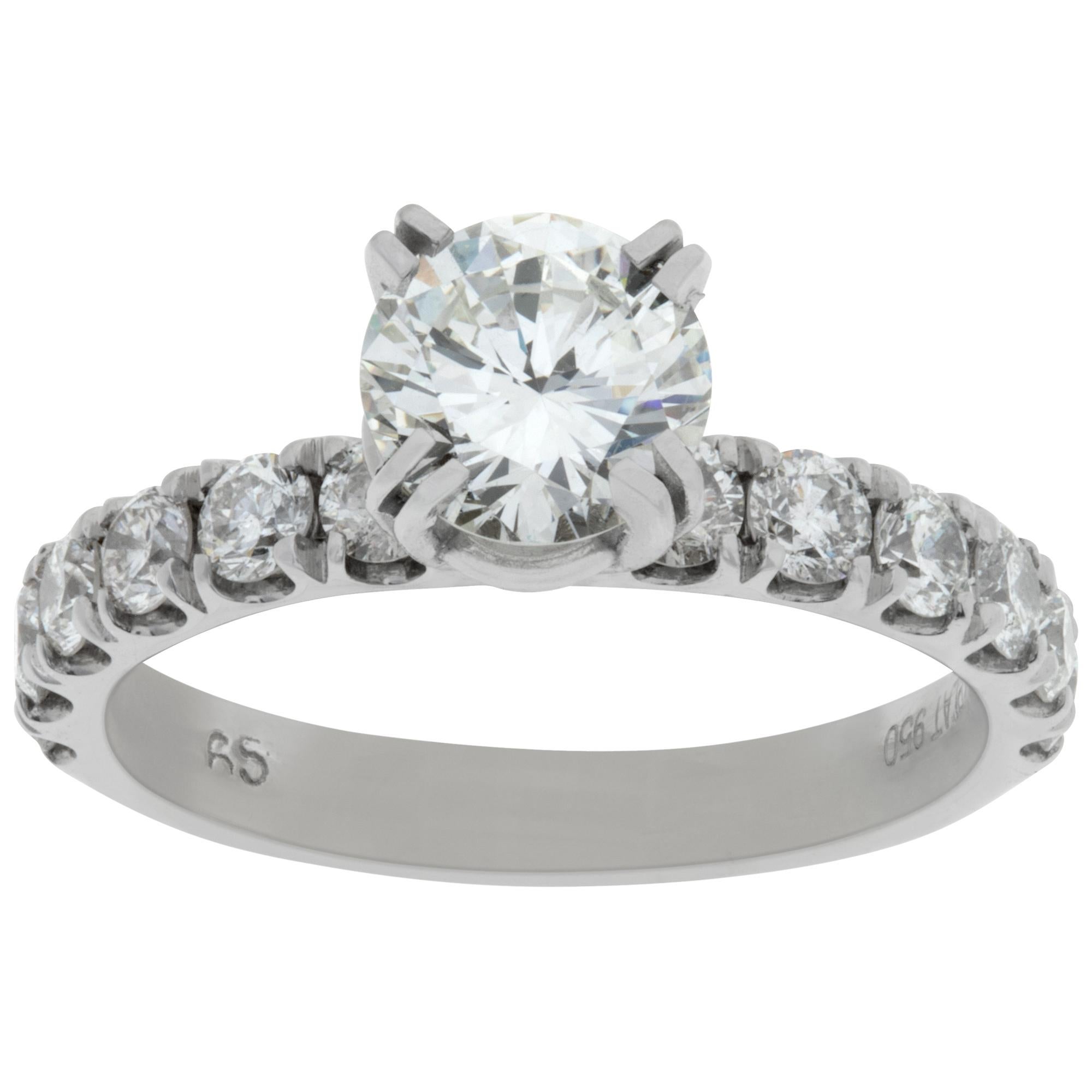 GIA certified round brilliant cut diamond 1.07 carat (I color, VS2 clarity) ring set in platinum with 12 diamonds total weight 1 carat G-H color, VS clarity. Size 6This GIA certified ring is currently size 6 and some items can be sized up or down,