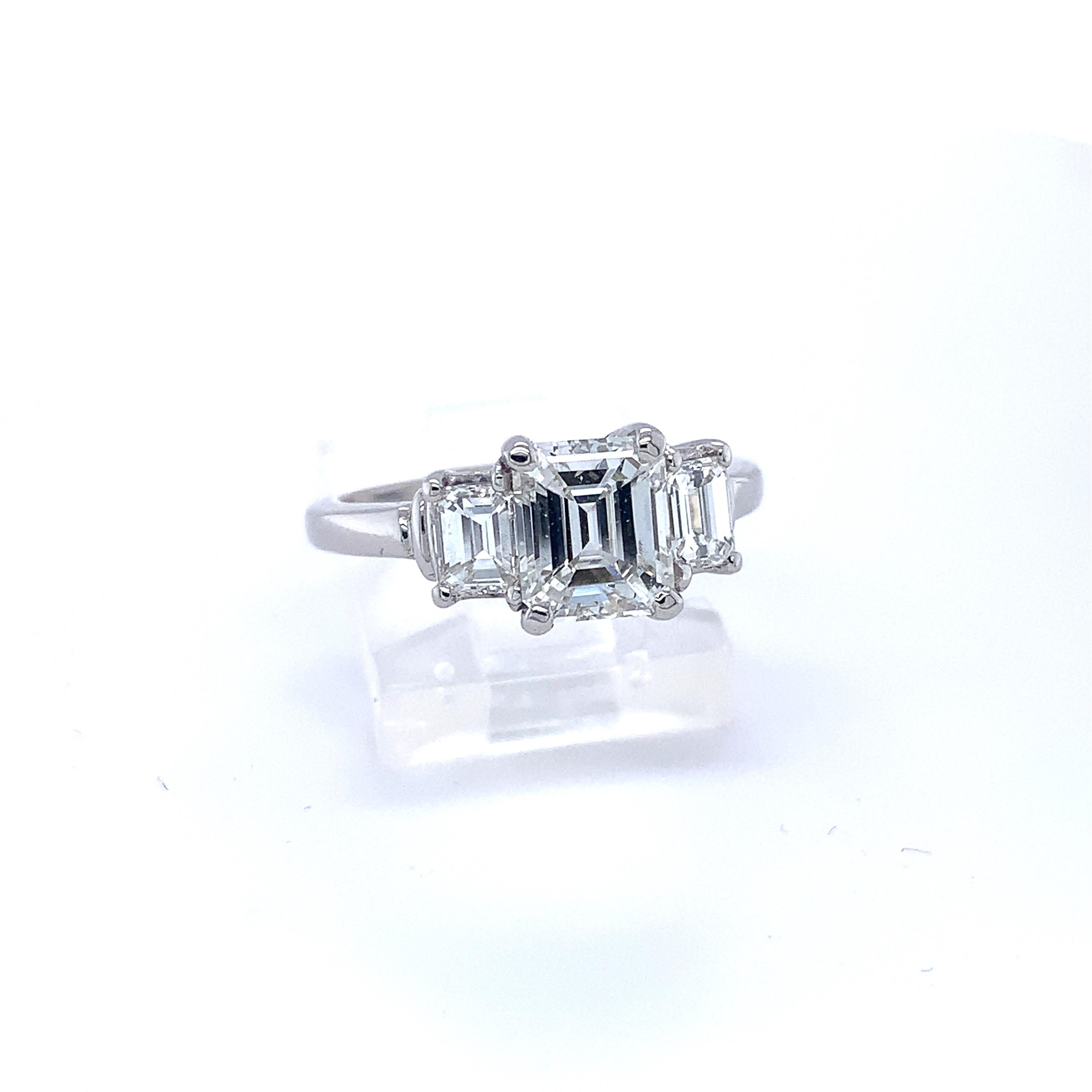 Platinum GIA Emerald Cut 2 Carat TW 3-Stone Genuine Natural Diamond Ring #J4938

Fabulous Platinum three-stone diamond engagement ring featuring a fine 1.39 carat emerald cut diamond with GIA Diamond Grading report stating white I color and super