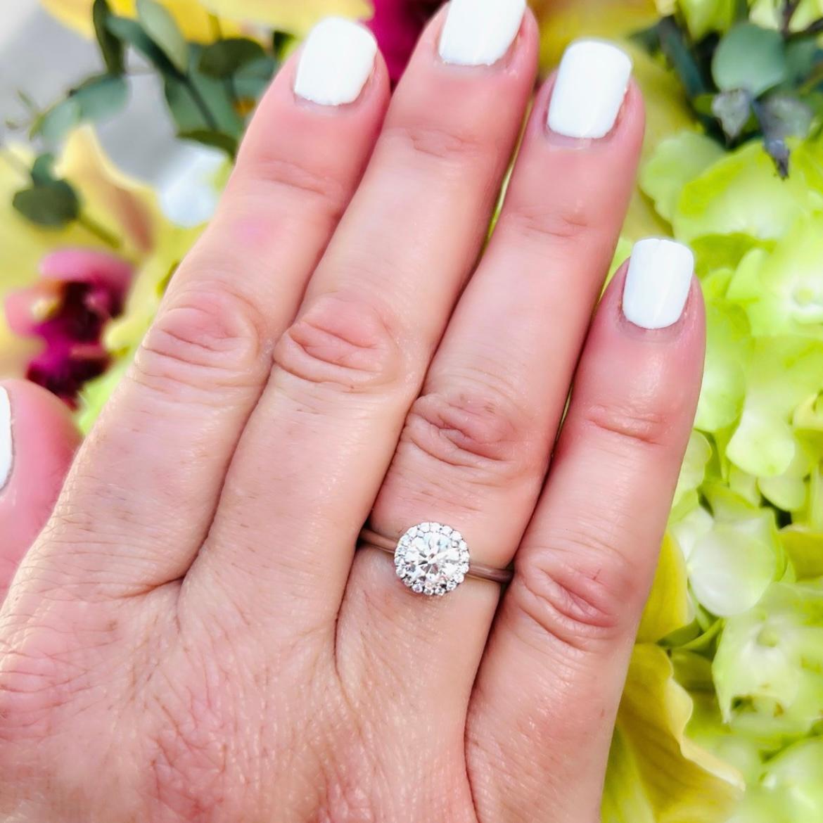 Clean and classic design meets exceptional fine diamonds in this gorgeous platinum diamond engagement ring. Featuring a round brilliant cut diamond at its center that weighs 0.80 carats and has been graded by the GIA as F/VS2 with an Excellent Cut