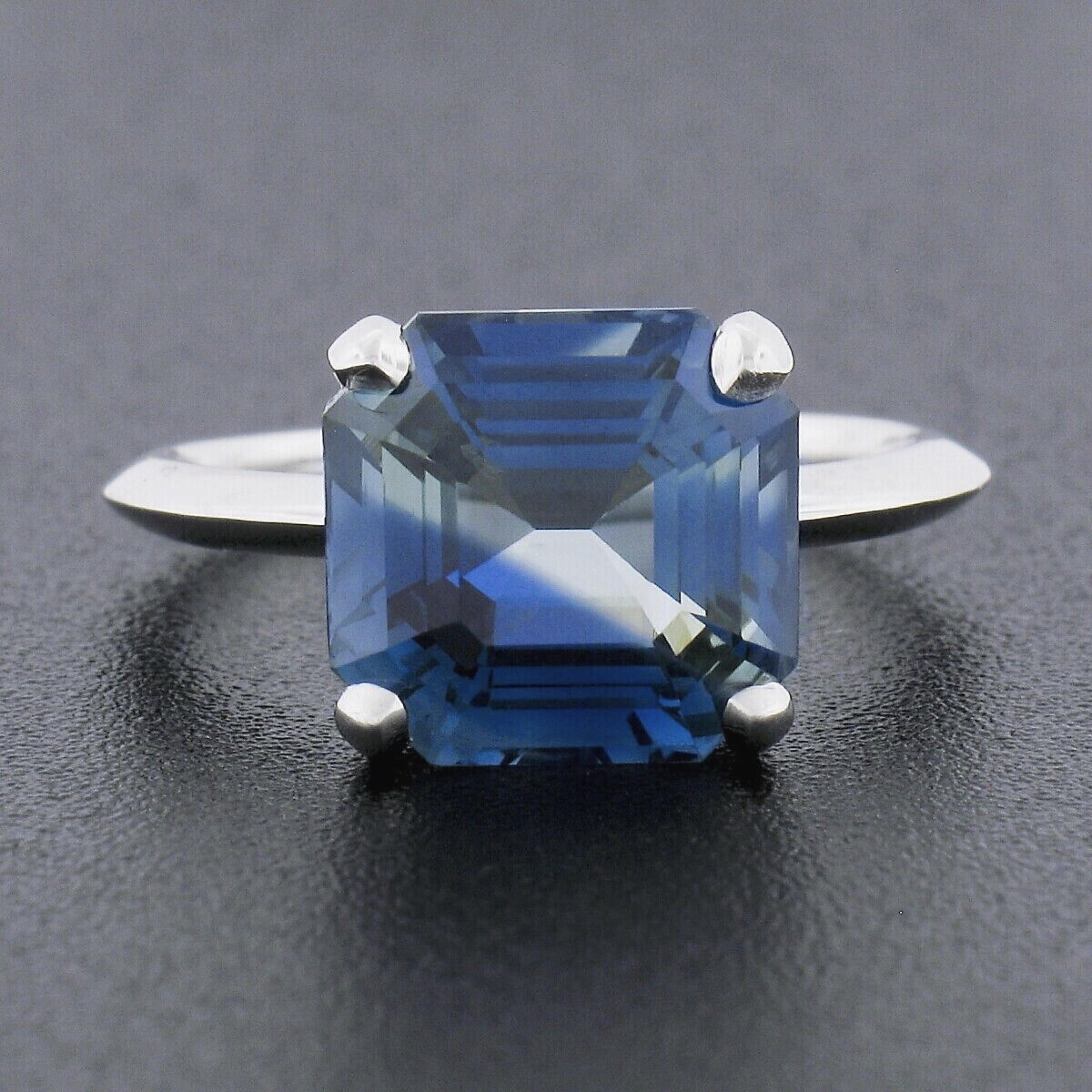 Here we have a truly magnificent sapphire solitaire ring newly crafted from solid platinum. The ring features an incredibly unique, 100% natural, GIA certified sapphire that has the most amazing naturally zoned greenish-blue color with no heat