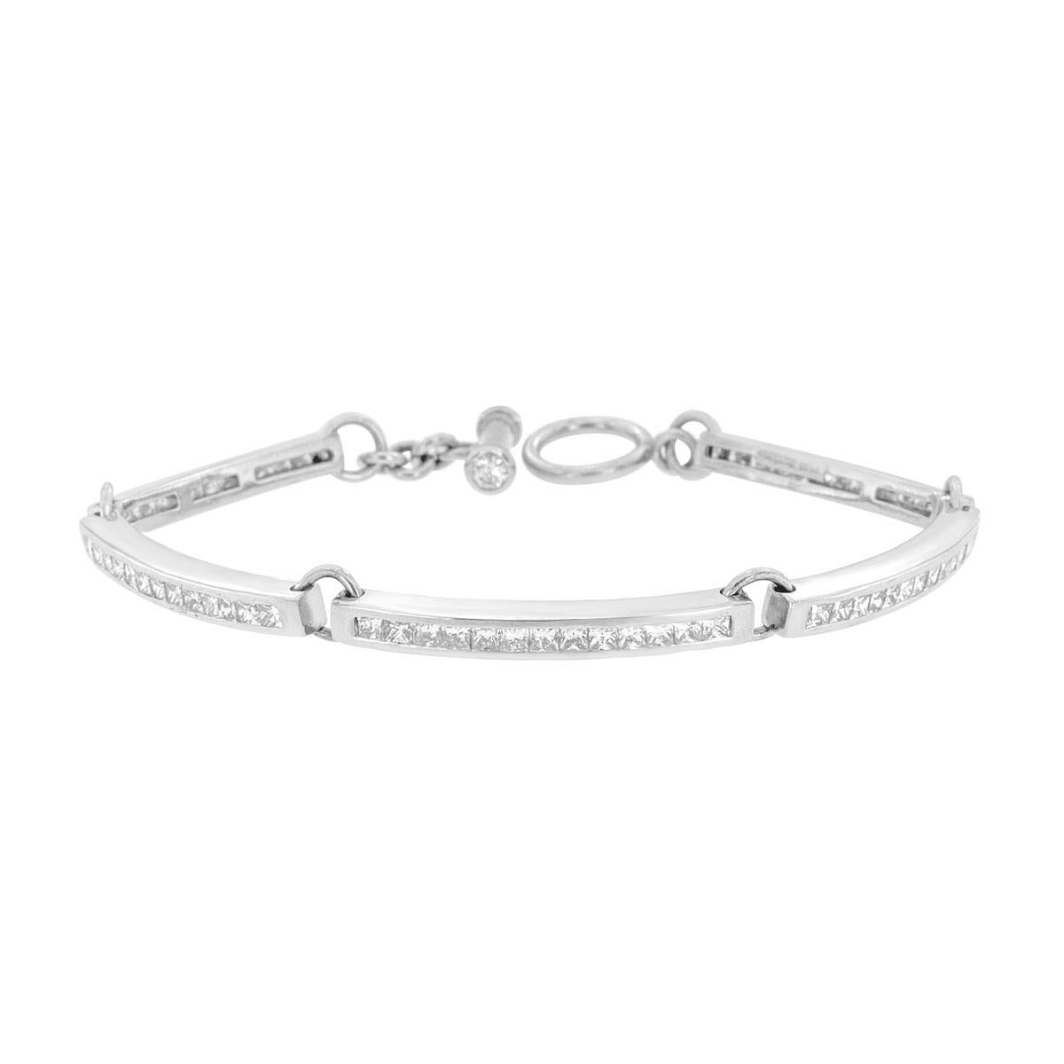 From our exclusive Gioia collection, this handcrafted bracelet showcase 65 perfectly matched Princess Shape diamonds channel set in Platinum. Two round diamonds are set into the Toggle clasp to create a divine unity between the diamonds and the