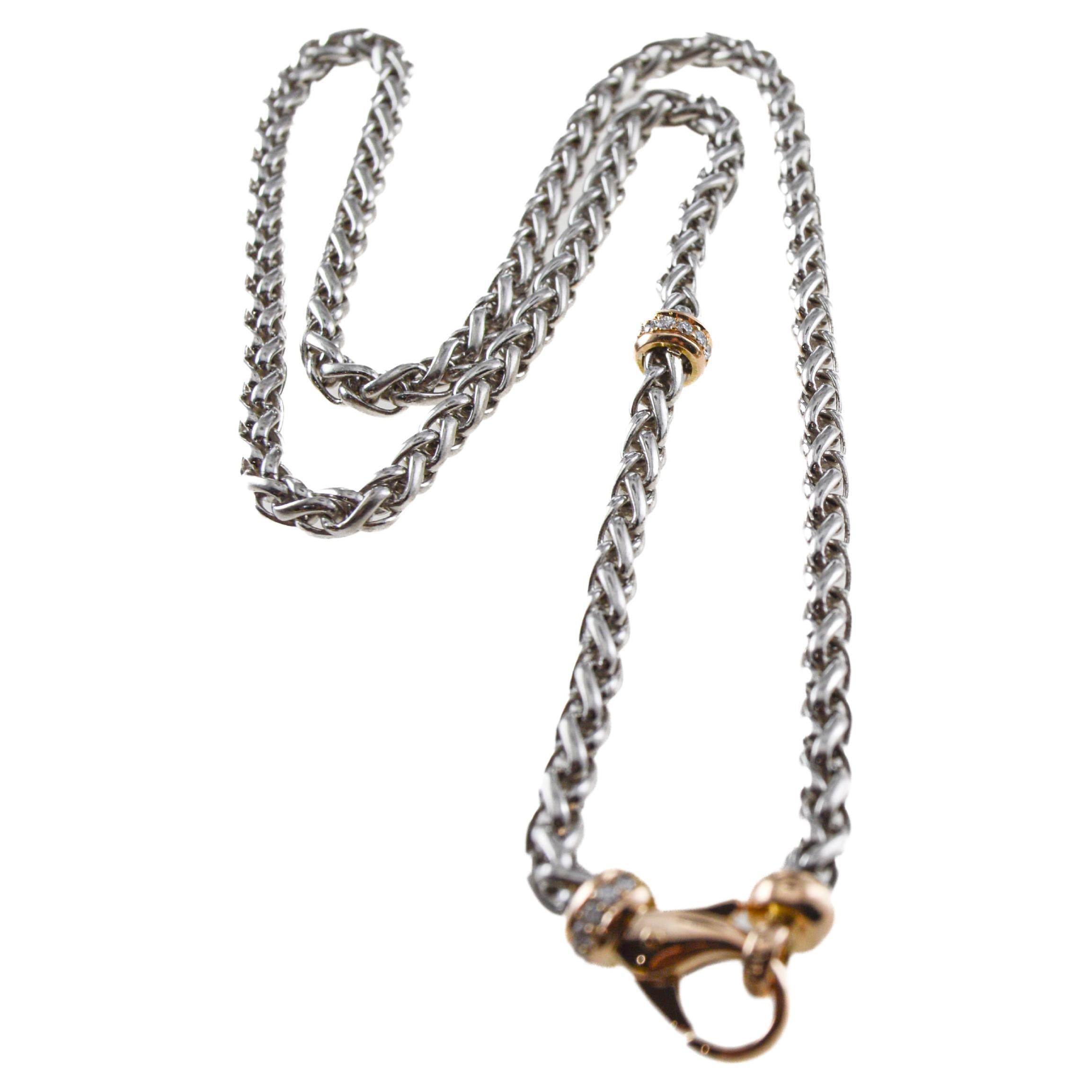 Dies ist eine großartig aussehende handgefertigte Halskette, ein Armband oder eine Taschenuhrkette.  Jedes Glied ist von Hand geflochten. Die Glieder sind aus Platin und der Dreh- und Federring aus Gelbgold mit Diamanten.  Wir haben diese Kette noch
