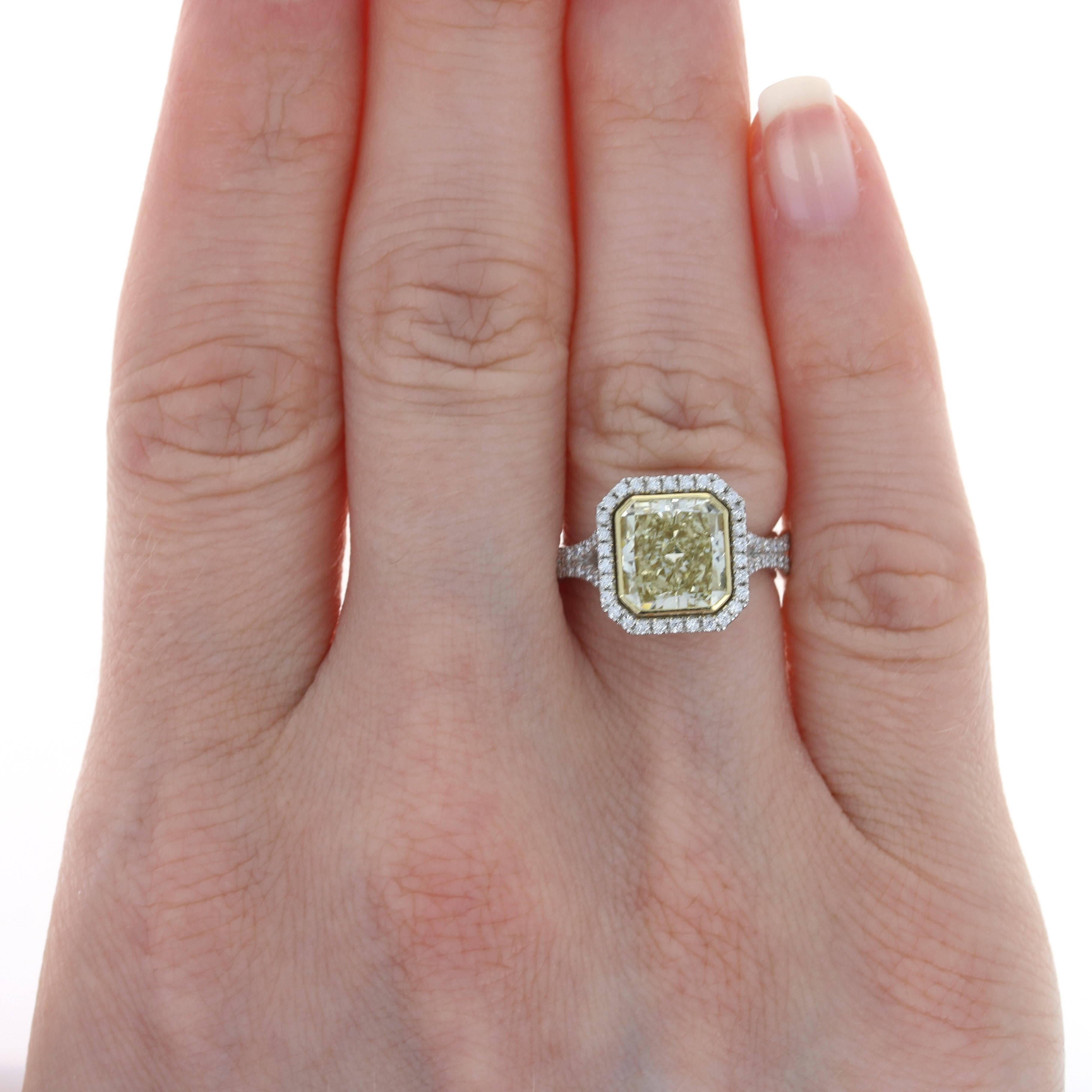 Size: 5 3/4
Please contact us for a quote on re-sizing this ring.

Metal Content: Platinum & 18k Yellow Gold 

Stone Information: 
Natural Diamond Solitaire
Carat: 2.74ct
Cut: Radiant 
Color: Fancy Yellow (fancy brownish greenish yellow, even