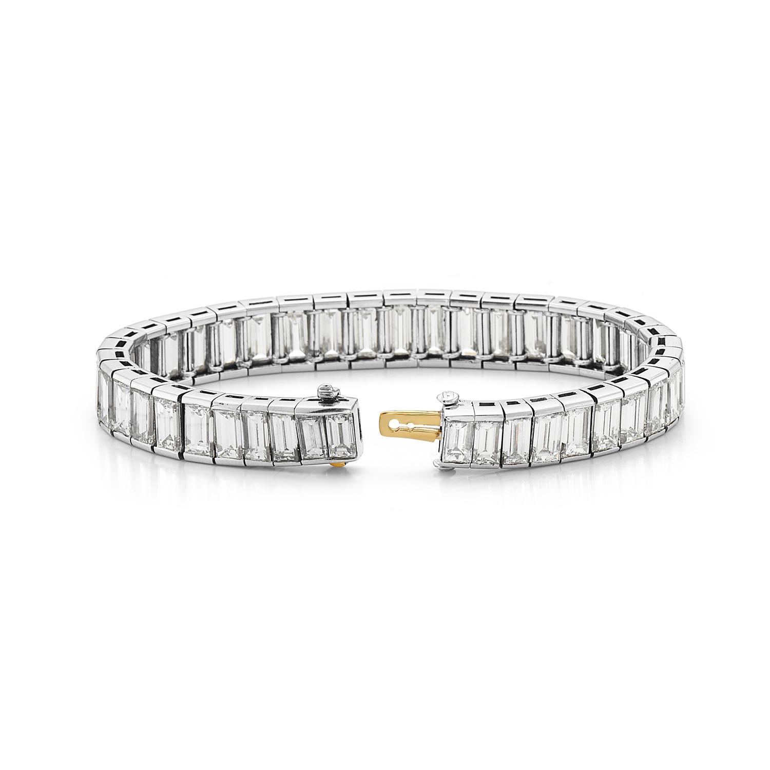This bracelet features 38 carats of F-G VS graduated baguette cut diamonds set in platinum. This bracelet is made by the highest quality Italian craftsmans making it extremely flexible with soft delicate movements. Hidden clasp closure. 7 inch