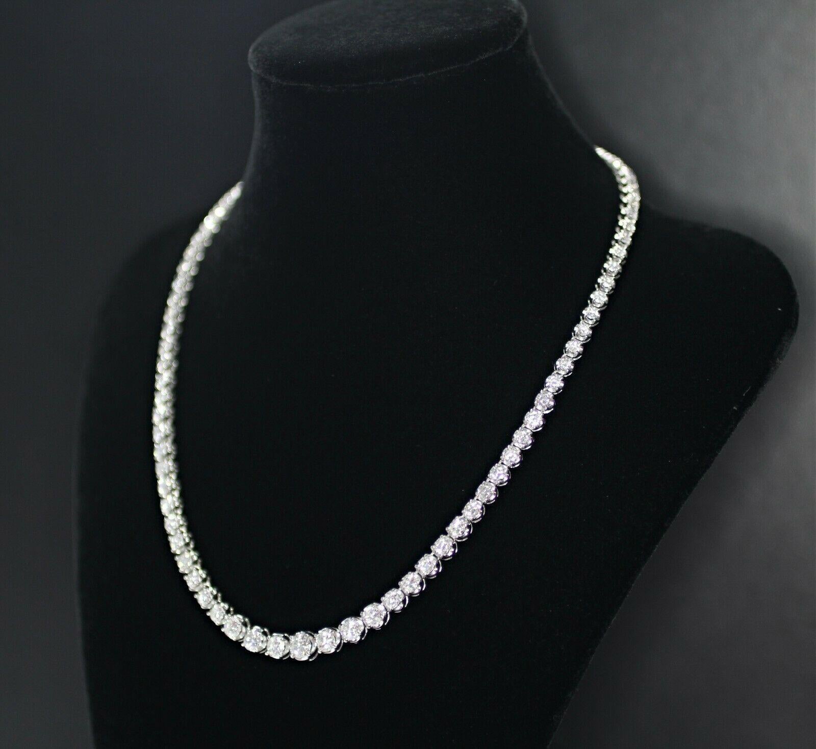 18k white gold graduated diamond necklace, containing 
 Specifications:
    main stone: ROUND CUT DIAMONDS
    diamonds: 88 PIECES
    carat total weight: 10.00
    color: F-G
    clarity: SI2
    brand: custom
    metal: 18k
    type: TENNIS