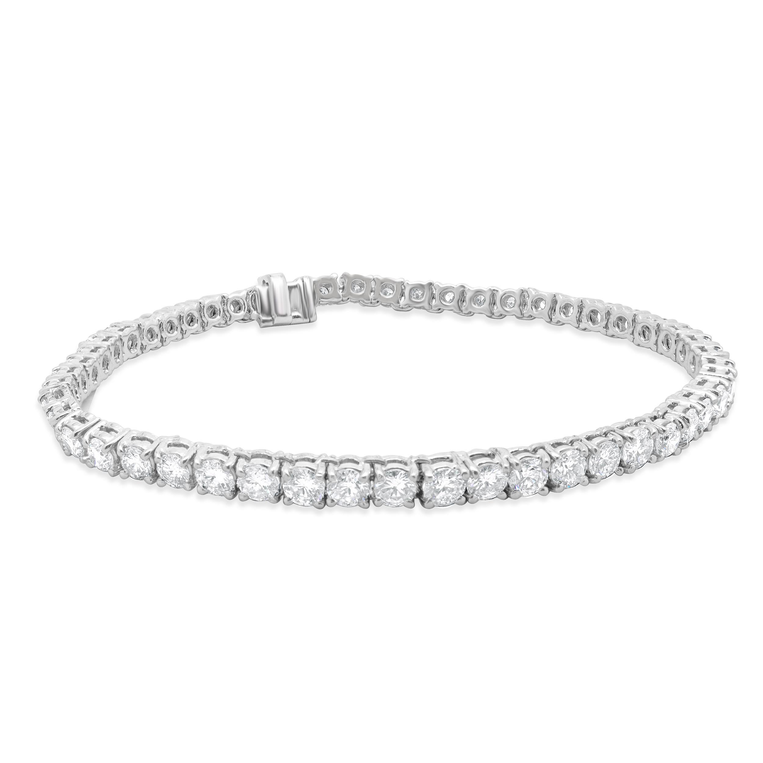 Designer: custom design
Material: platinum
Diamond: 44 round brilliant cut = 4.86cttw
Color: H
Clarity: SI2
Dimensions: bracelet will fit up to a 7-inch wrist
Weight: 17.89 grams
