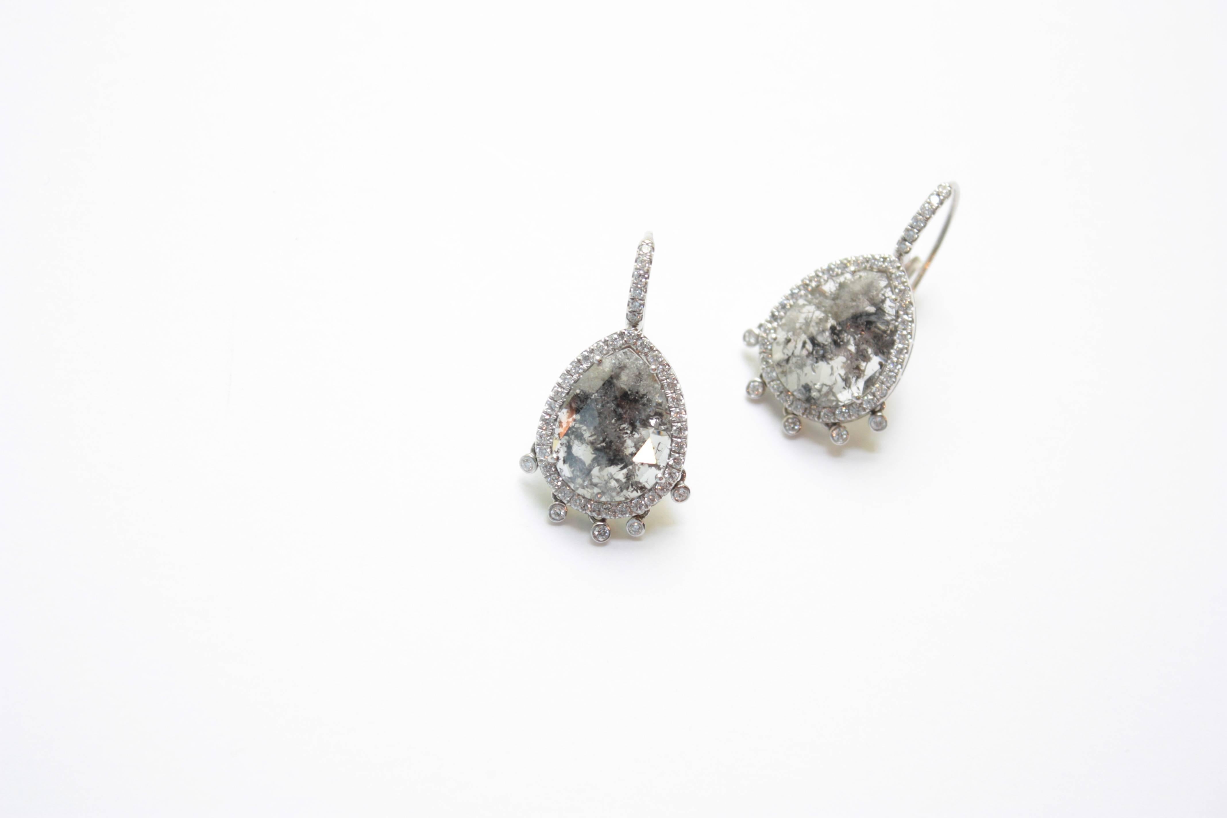 Shimmee® Eardrops
A pair of platinum eardrops, paying tribute to an unusual pair of pear-shaped grey rose-cut diamonds.  Each eardrop begins with a diamond-encrusted earwire, holding the large pear-shaped diamond in its white diamond frame.  For