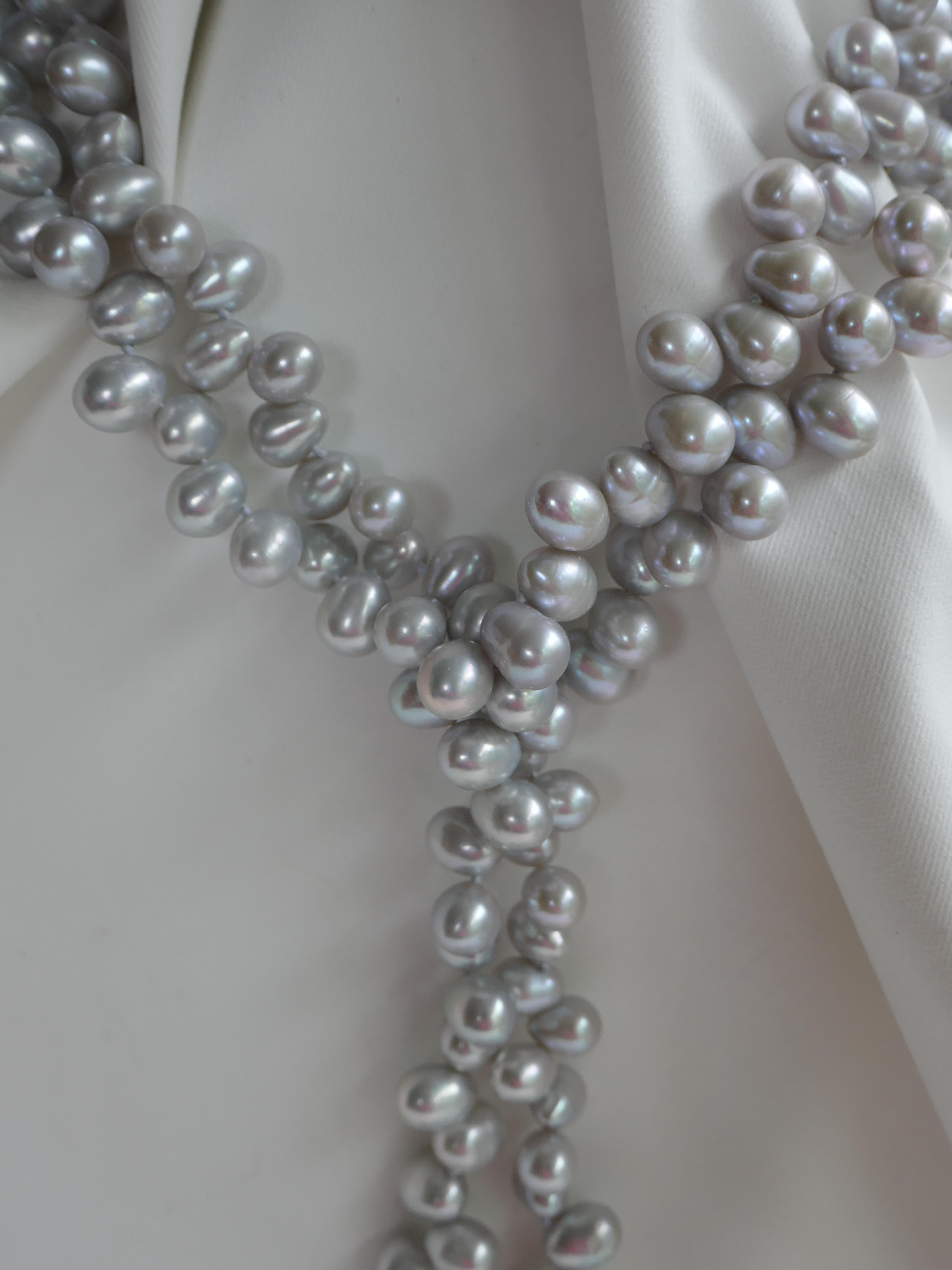 The drop cultured pearls in this necklace are Platinum in color and finished with a keshi sterling silver chain tassel, and baroque cultured pearls.  The drop cultured pearls 9-9.5mm and  have great luster and very little blemishes. The tassel is 3