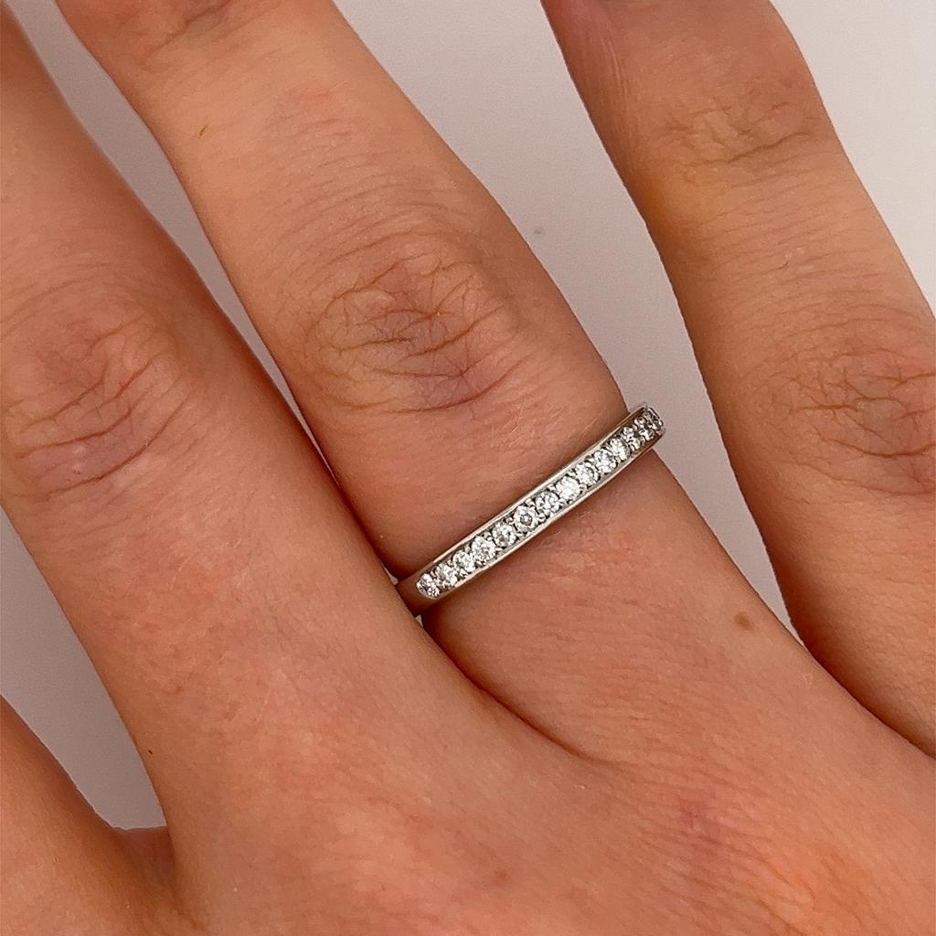 This diamond half eternity band is set with 0.25ct round brilliant cut diamonds. This pre-loved ring is elegant and beautiful for a wedding ring,
set in platinum. (tested as platinum, but not hallmarked)

Total Diamond Weight: 0.25ct 
Diamond