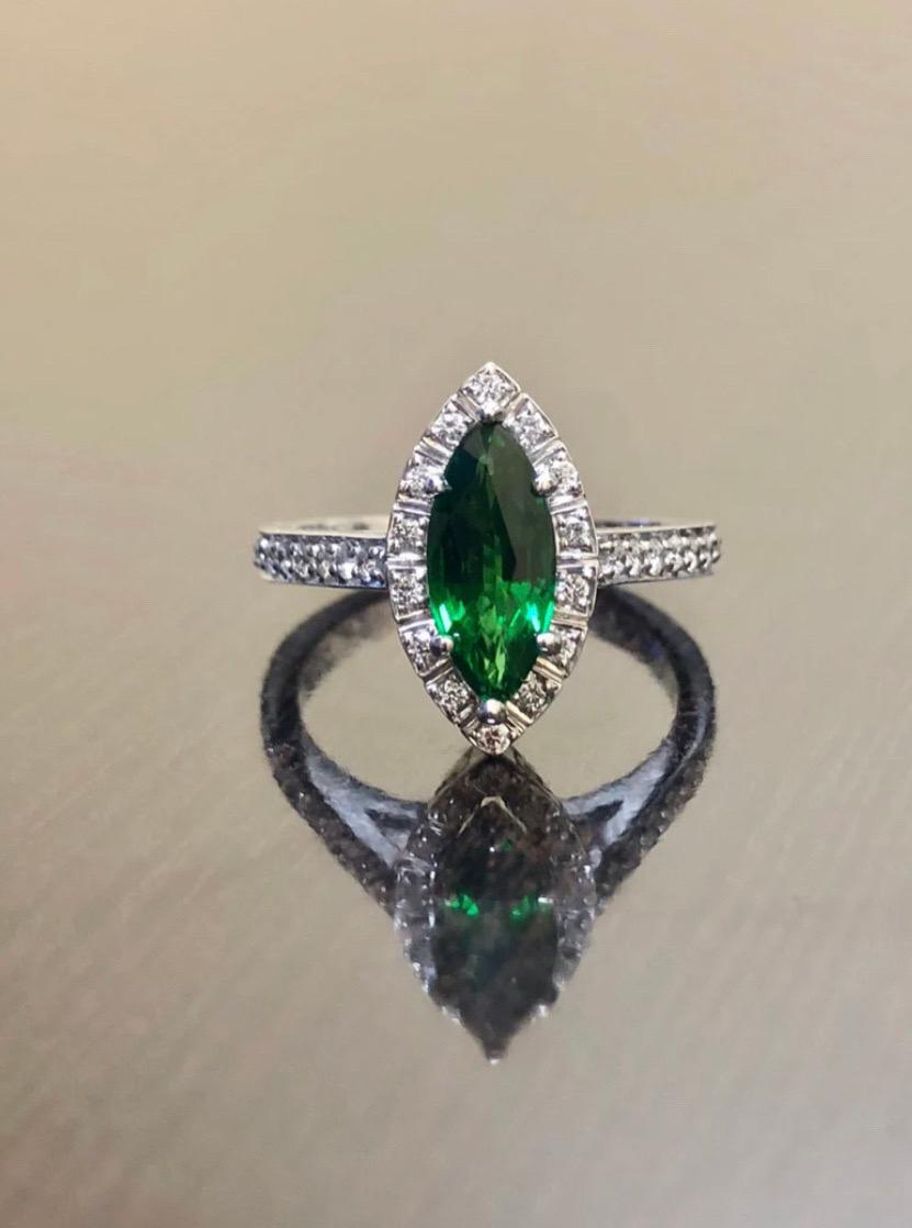 DeKara Designs Collection

Metal- 90% Platinum, 10% Iridium.

Stones- 1 Genuine Marquise Tsavorite 1.19 Carats, 33 Round Diamonds F-G Color VS1-VS2 Clarity 0.42 Carats.

Size- 6 1/2.

Art Deco Inspired Handmade Platinum Halo Diamond Marquise