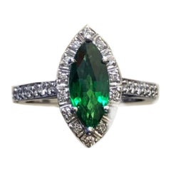 Anello di fidanzamento in platino con diamante aureolato da 1,19 carati e granato tsavorite marquise