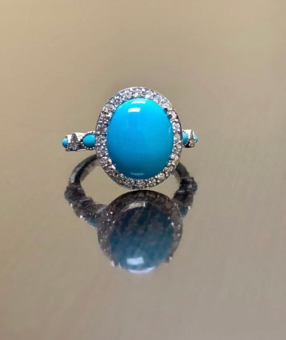 Collection/One Designs

Métal - 90 % de platine, 10 % d'iridium.

Pierres - Au centre, un cabochon de turquoise Belle au bois dormant de 12 x 10 MM de 2,20 à 2,50 carats, quatre turquoises marquées, 32 diamants ronds de couleur F-G et de pureté VS2,